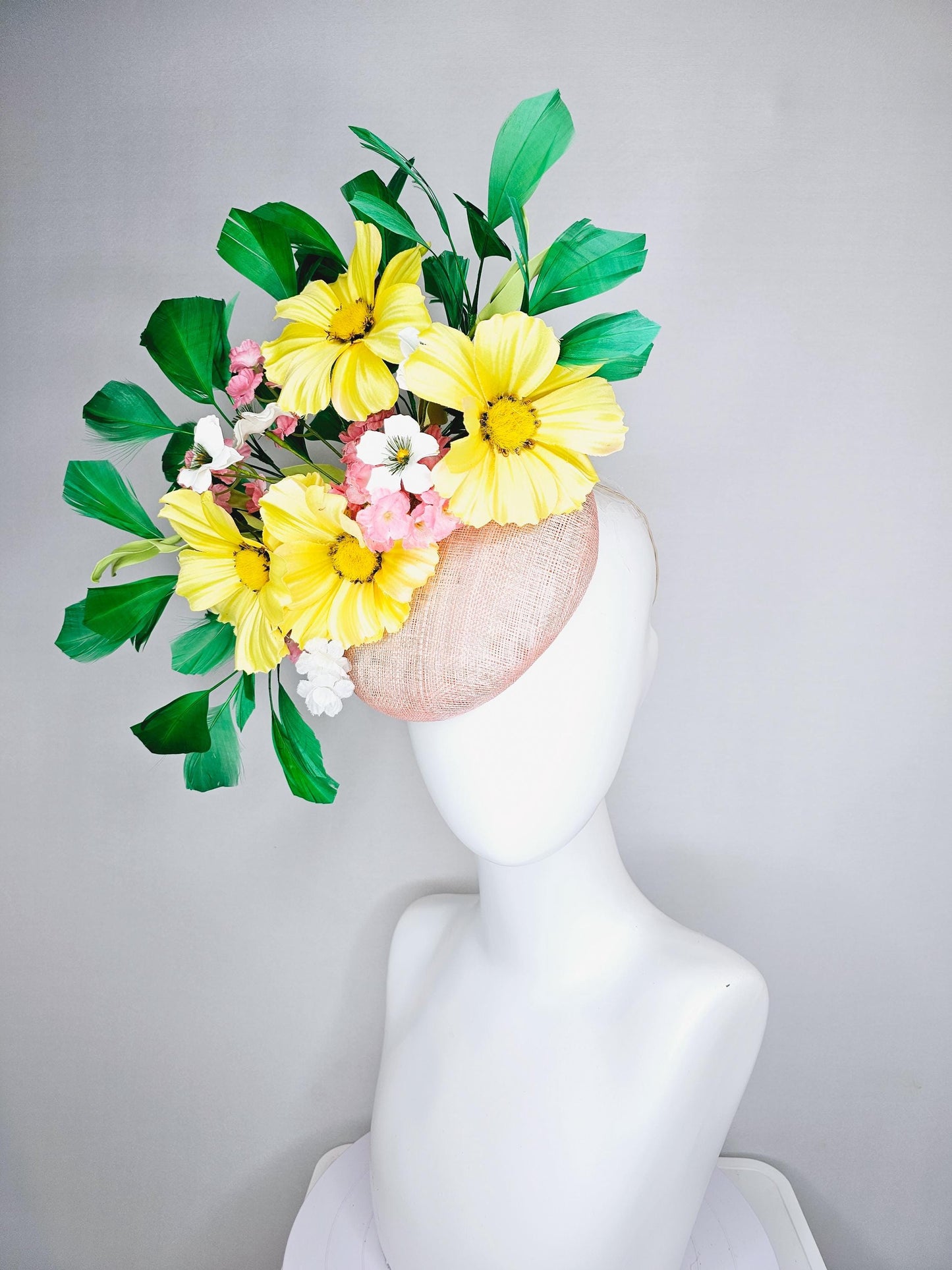 kentucky derby hat fascinator light pink sinamay with yellow white blush pink satin flowers, green leaves, emerald green branching feathers