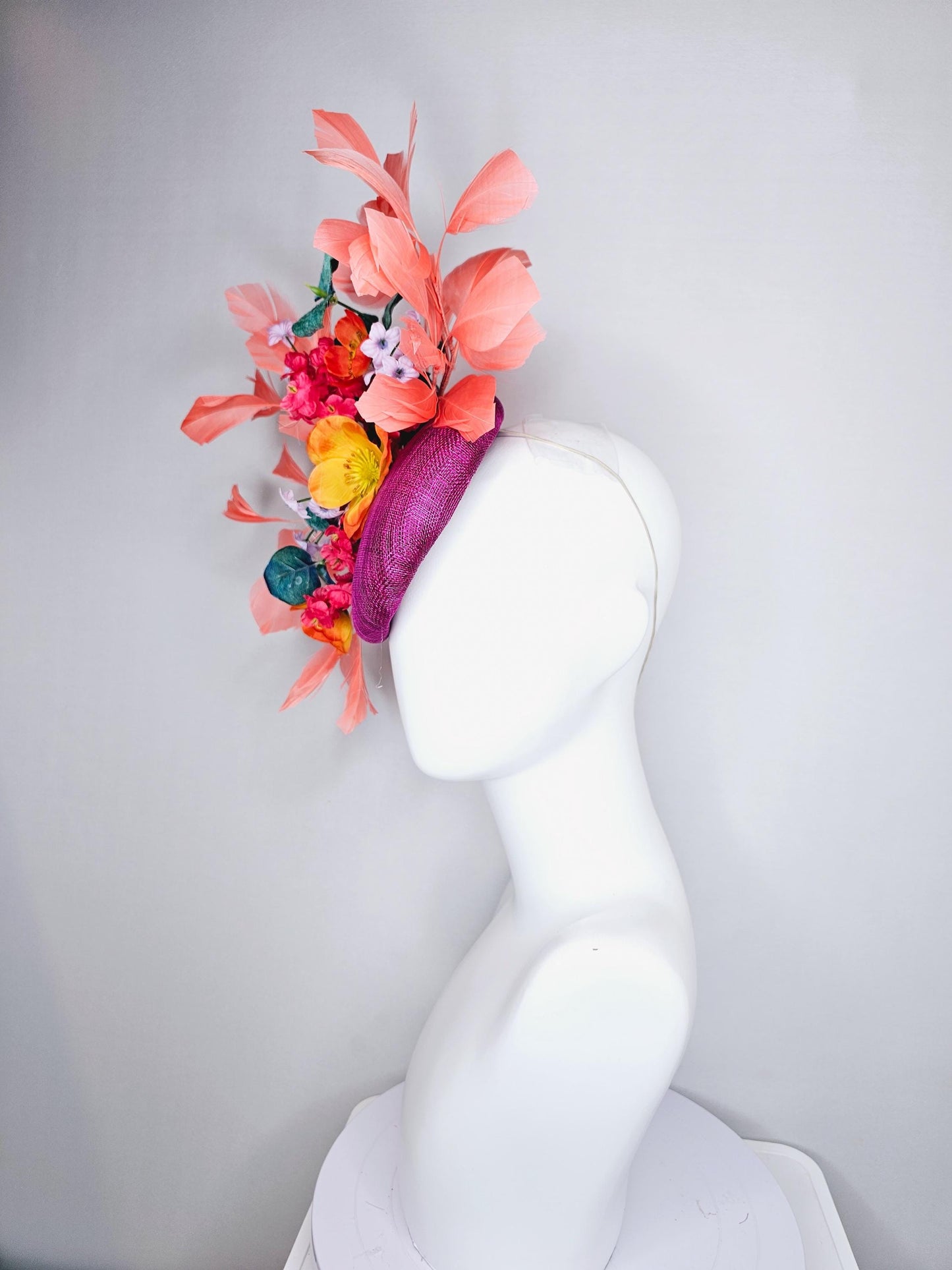 kentucky derby hat fascinator magenta purple sinamay, orange cherry red white satin flowers,teal blue leaves,coral orange branching feathers