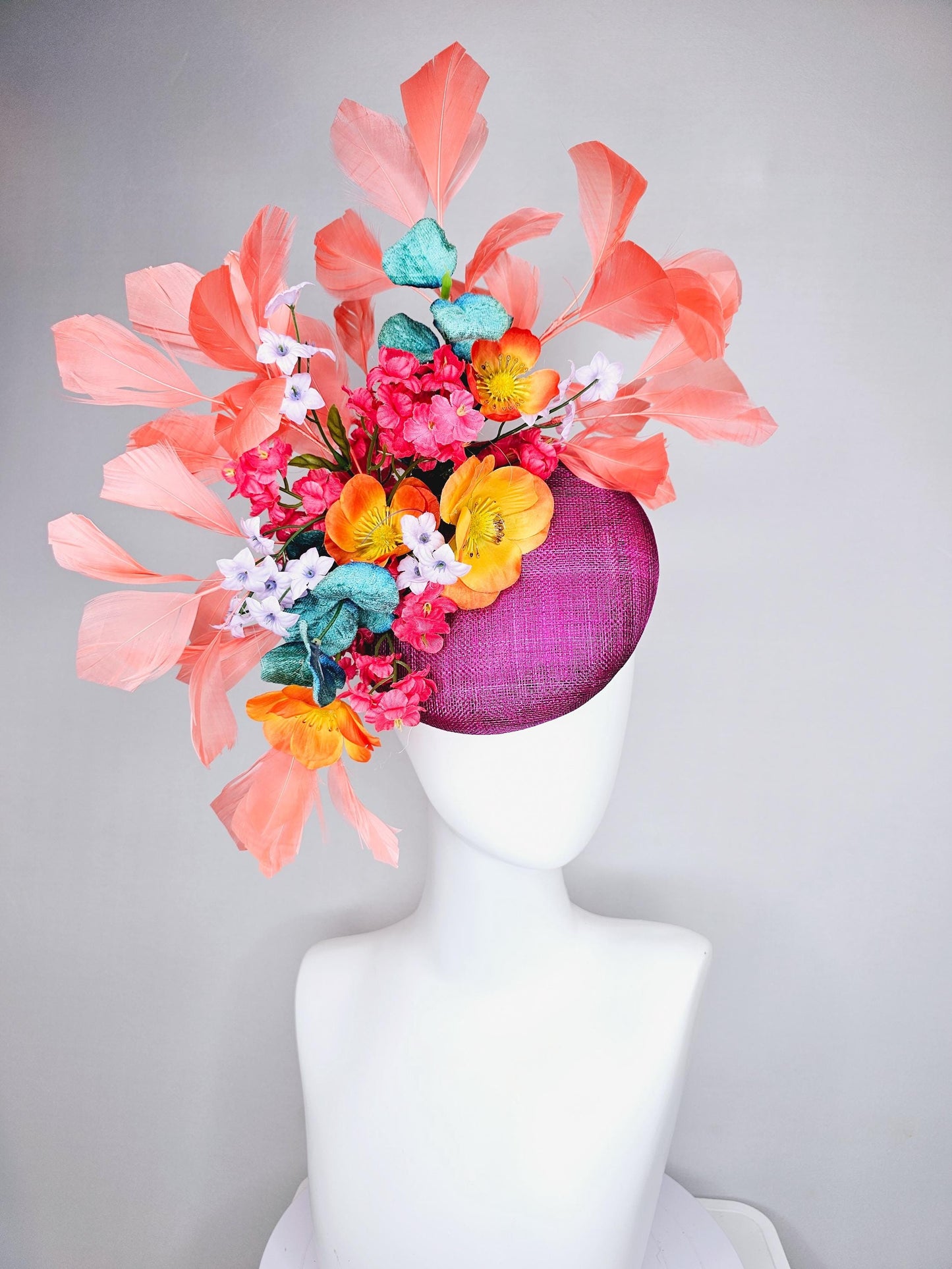 kentucky derby hat fascinator magenta purple sinamay, orange cherry red white satin flowers,teal blue leaves,coral orange branching feathers