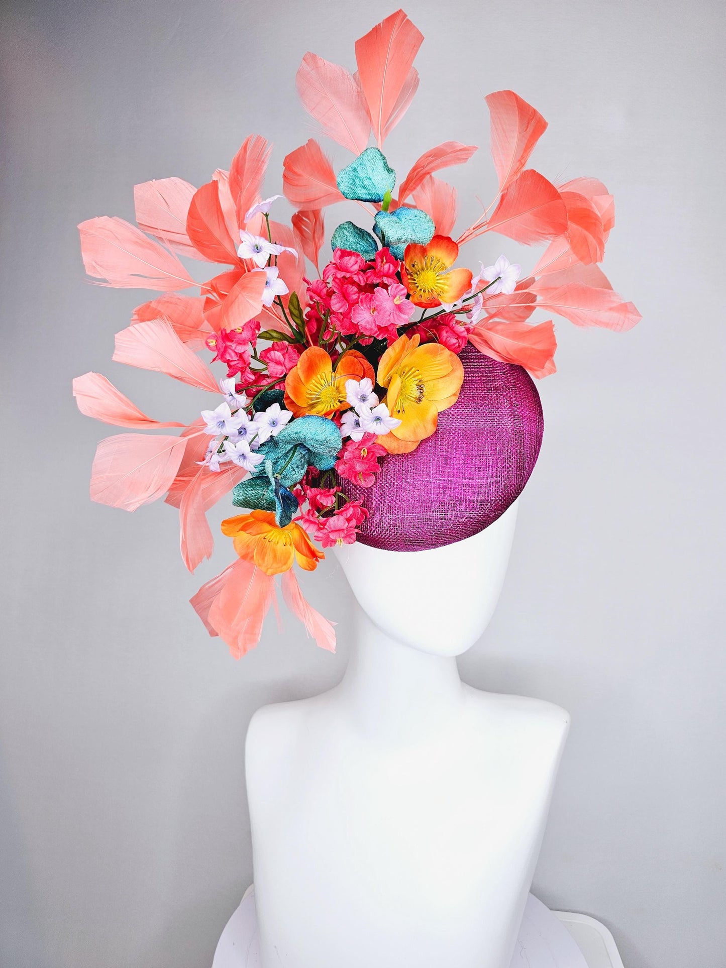 kentucky derby hat fascinator magenta purple sinamay, orange cherry red white satin flowers,teal blue leaves,coral orange branching feathers