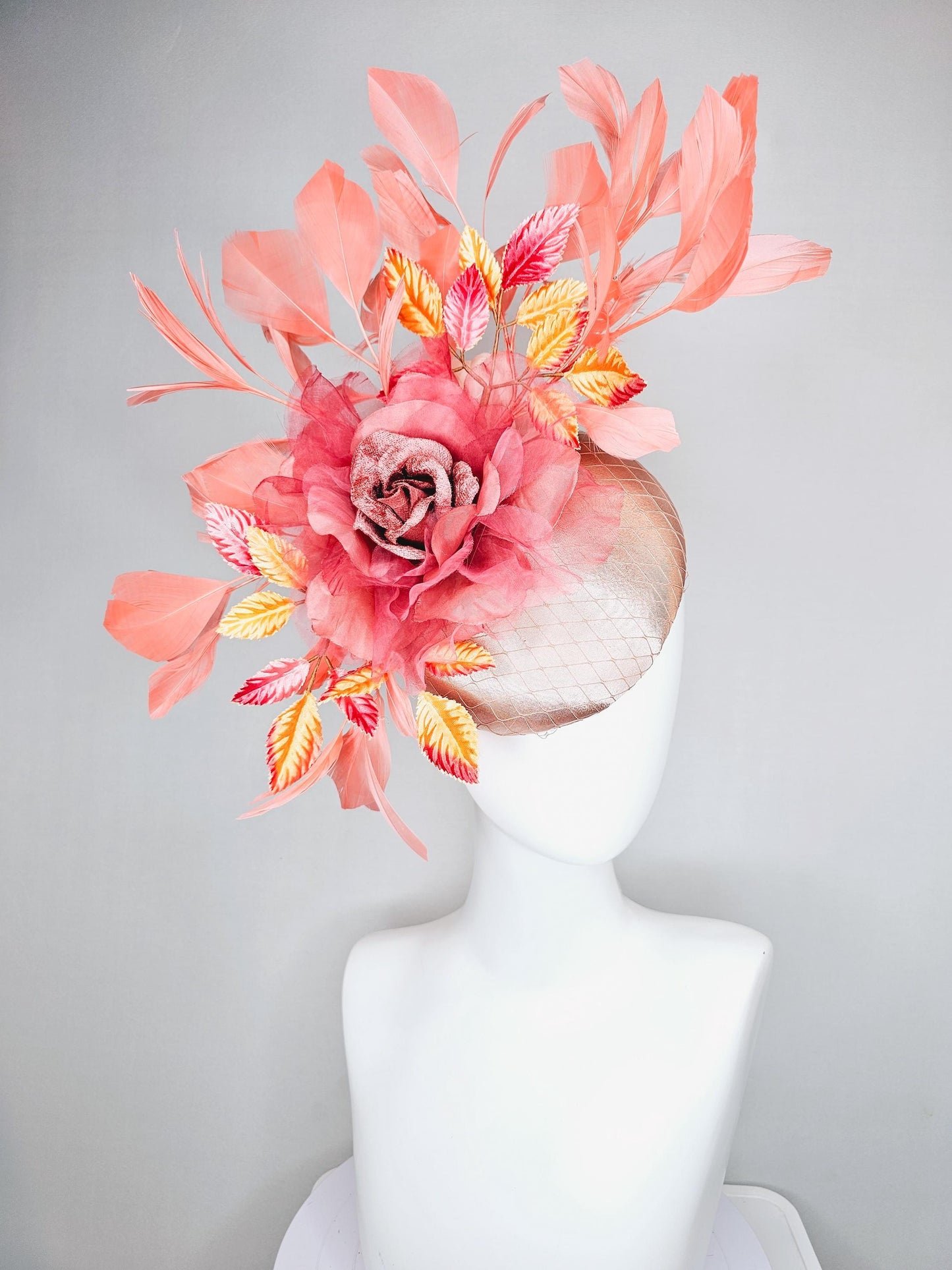 kentucky derby hat fascinator light pink satin w/ netting, dusty pink organza flower,yellow and pink leaves, peach orange branching feathers