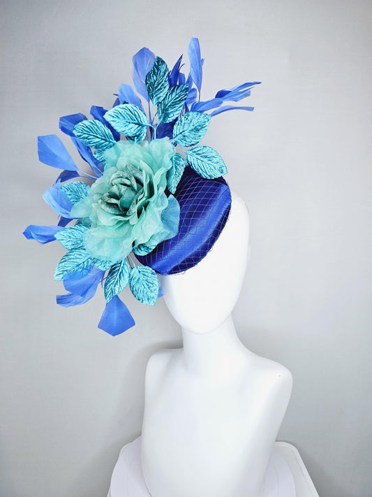 kentucky derby hat fascinator royal blue satin with netting, green blue organza rose flower, sky blue leaves, cobalt blue branching feathers