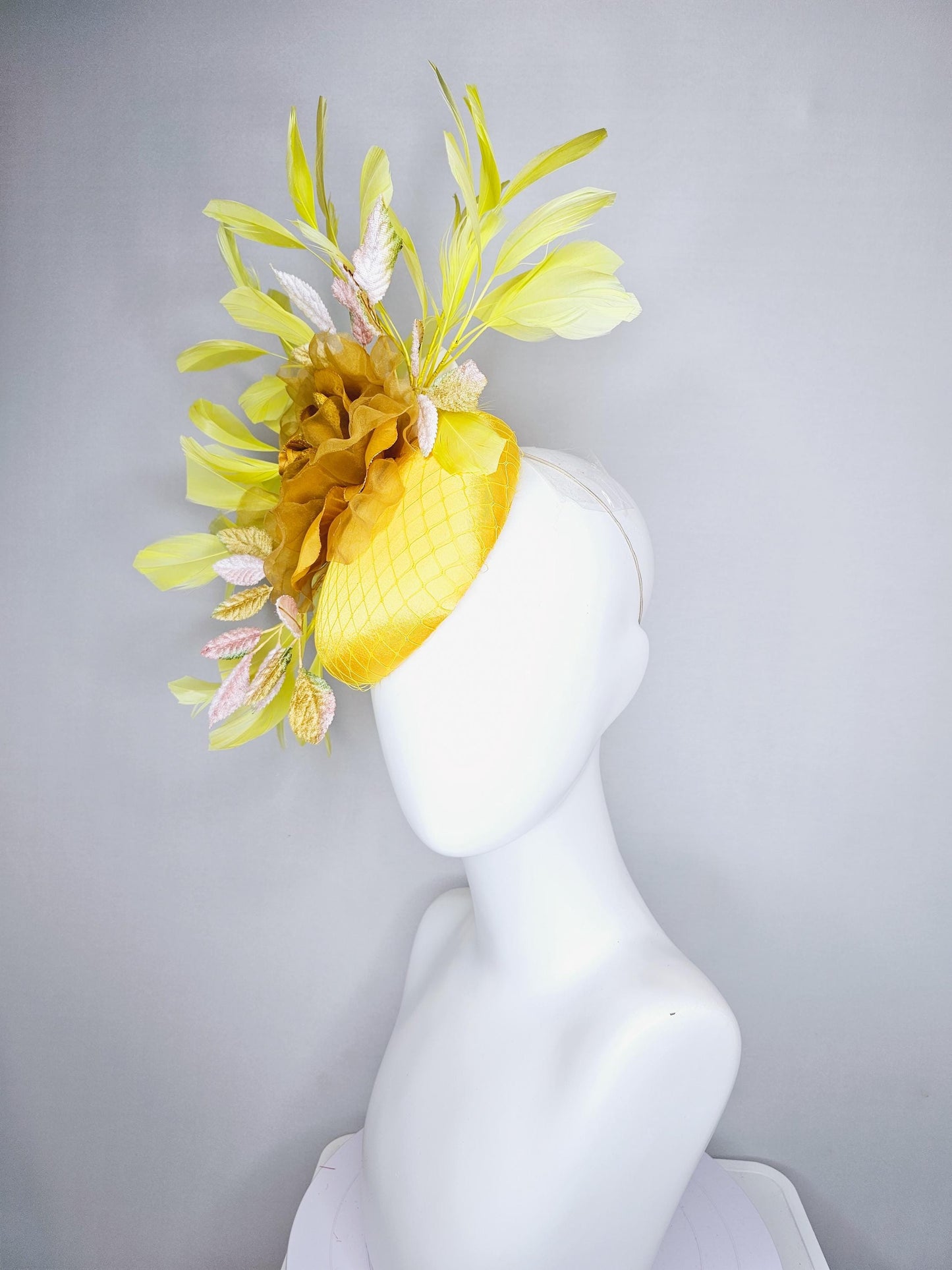 kentucky derby hat fascinator yellow satin with netting, mustard yellow organza flower, light pink yellow leaves, yellow branching feathers