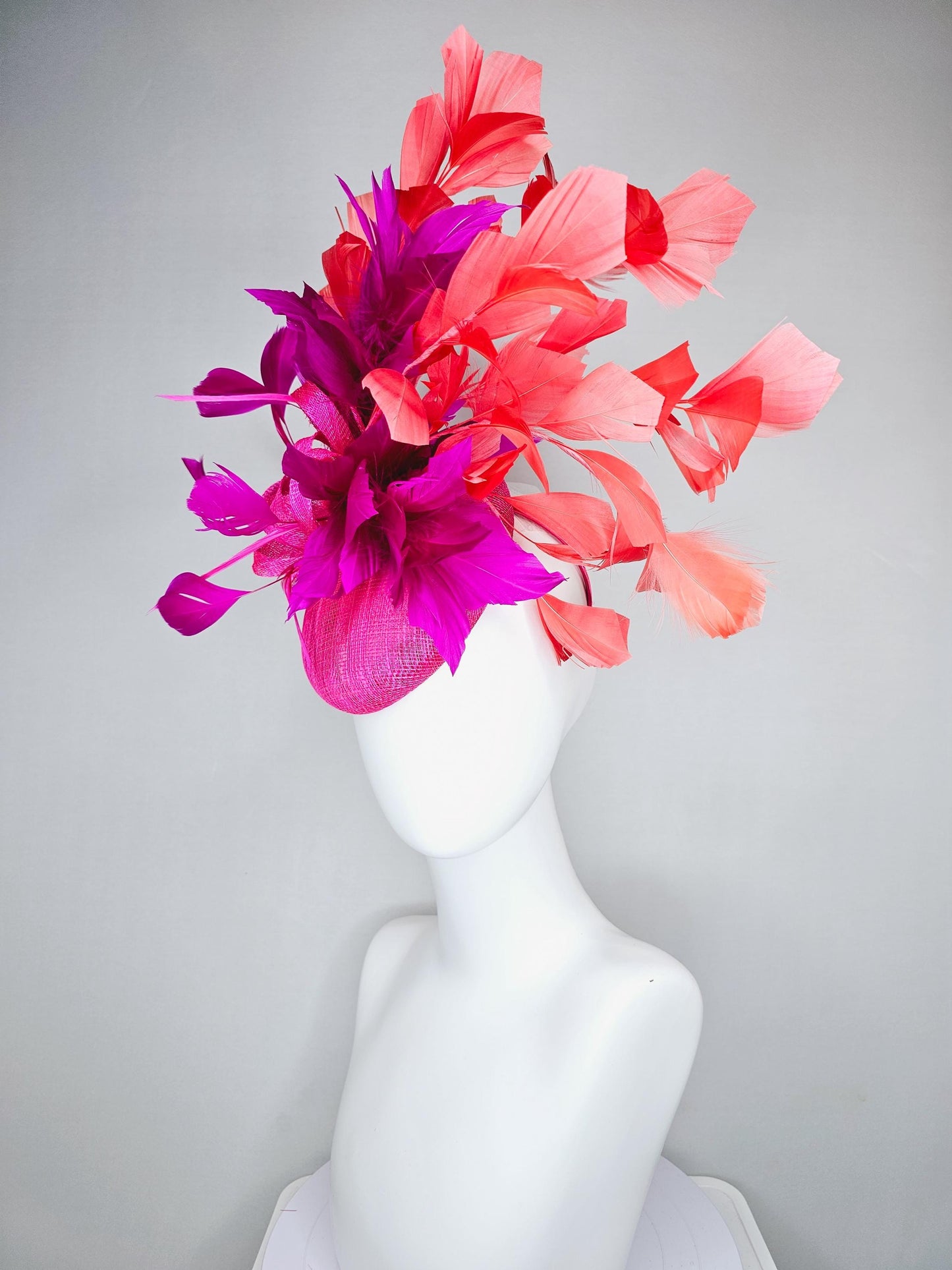 kentucky derby hat fascinator hot bright pink sinamay base with bright pink sinamay bow flower, pink fuchsia coral orange branching feathers