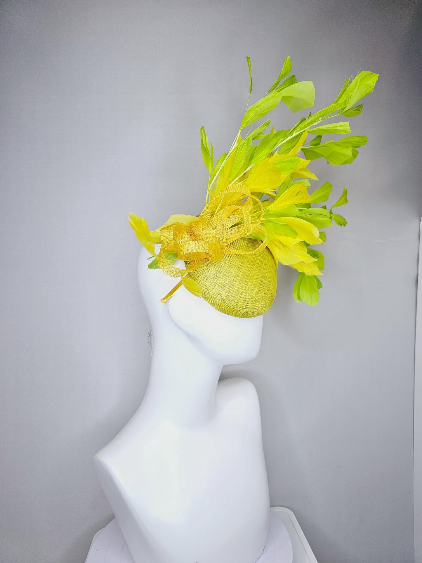 kentucky derby hat fascinator yellow sinamay base with yellow sinamay bow, yellow and yellow lime green branching feathers