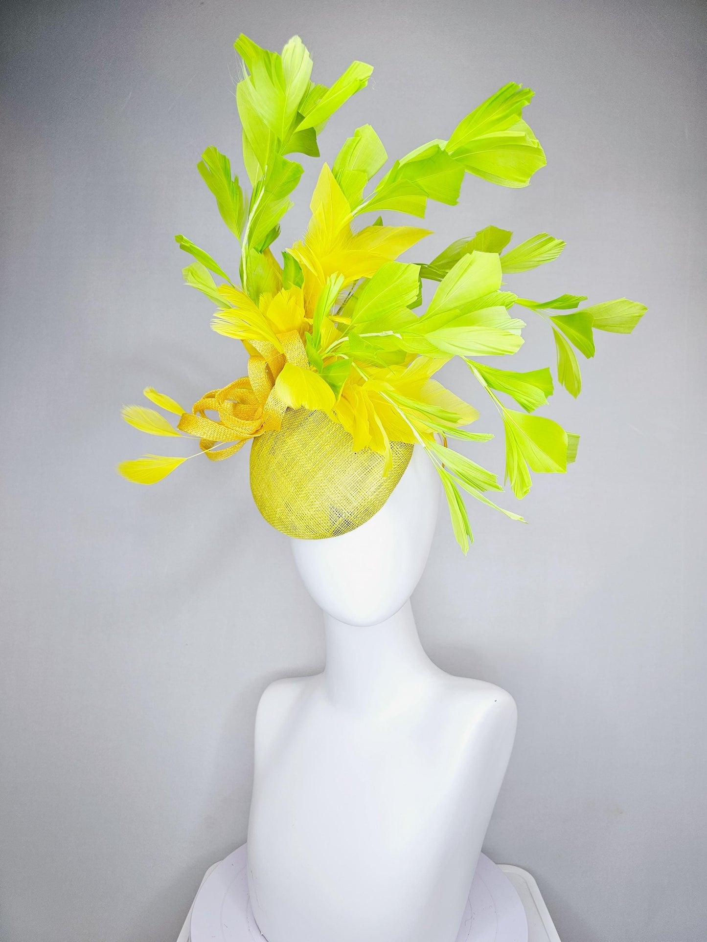 kentucky derby hat fascinator yellow sinamay base with yellow sinamay bow, yellow and yellow lime green branching feathers