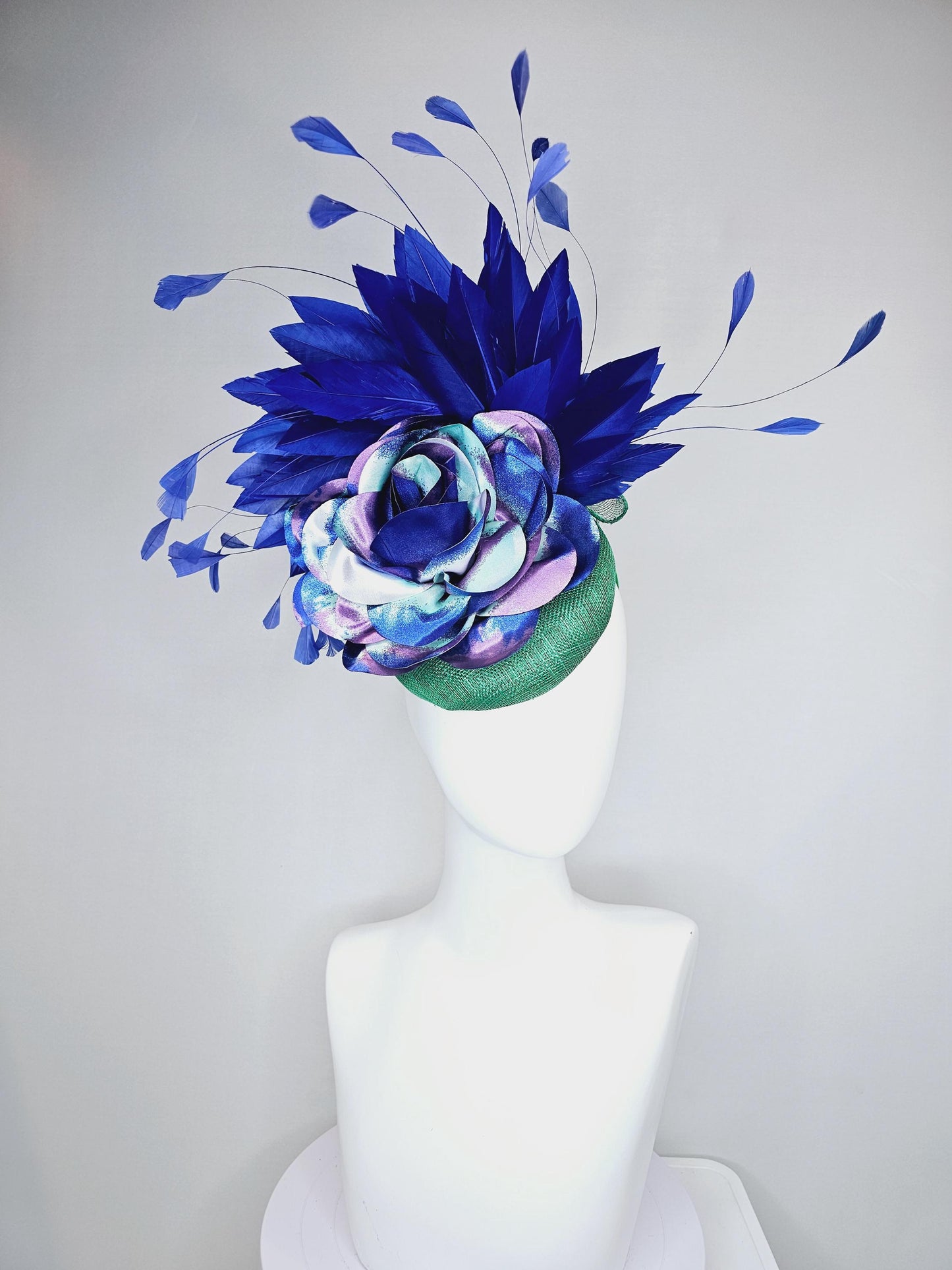 kentucky derby hat fascinator green sinamay, cobalt blue branching feathers and large blue,turquoise and purple ombre satin rose flower