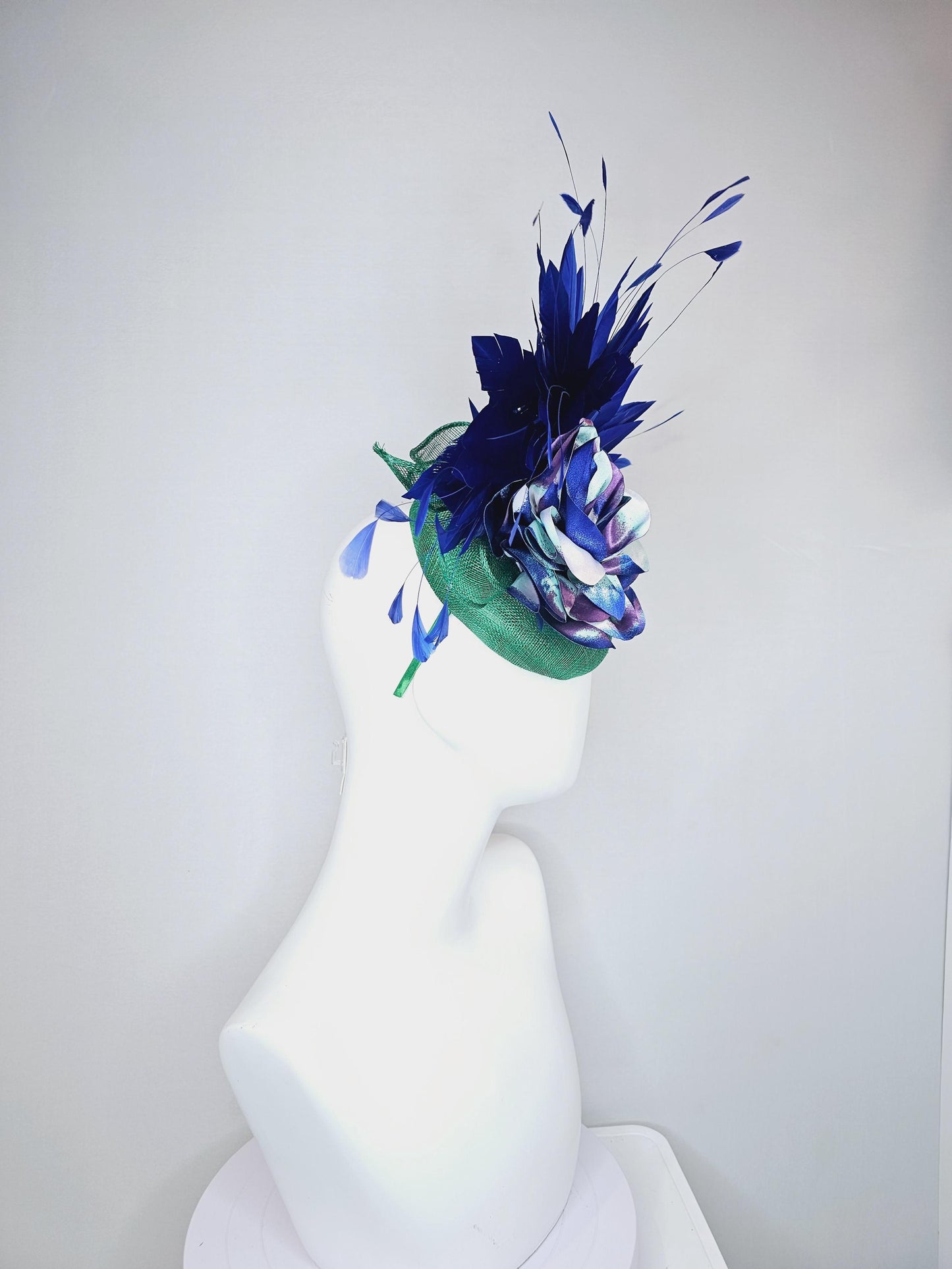 kentucky derby hat fascinator green sinamay, cobalt blue branching feathers and large blue,turquoise and purple ombre satin rose flower