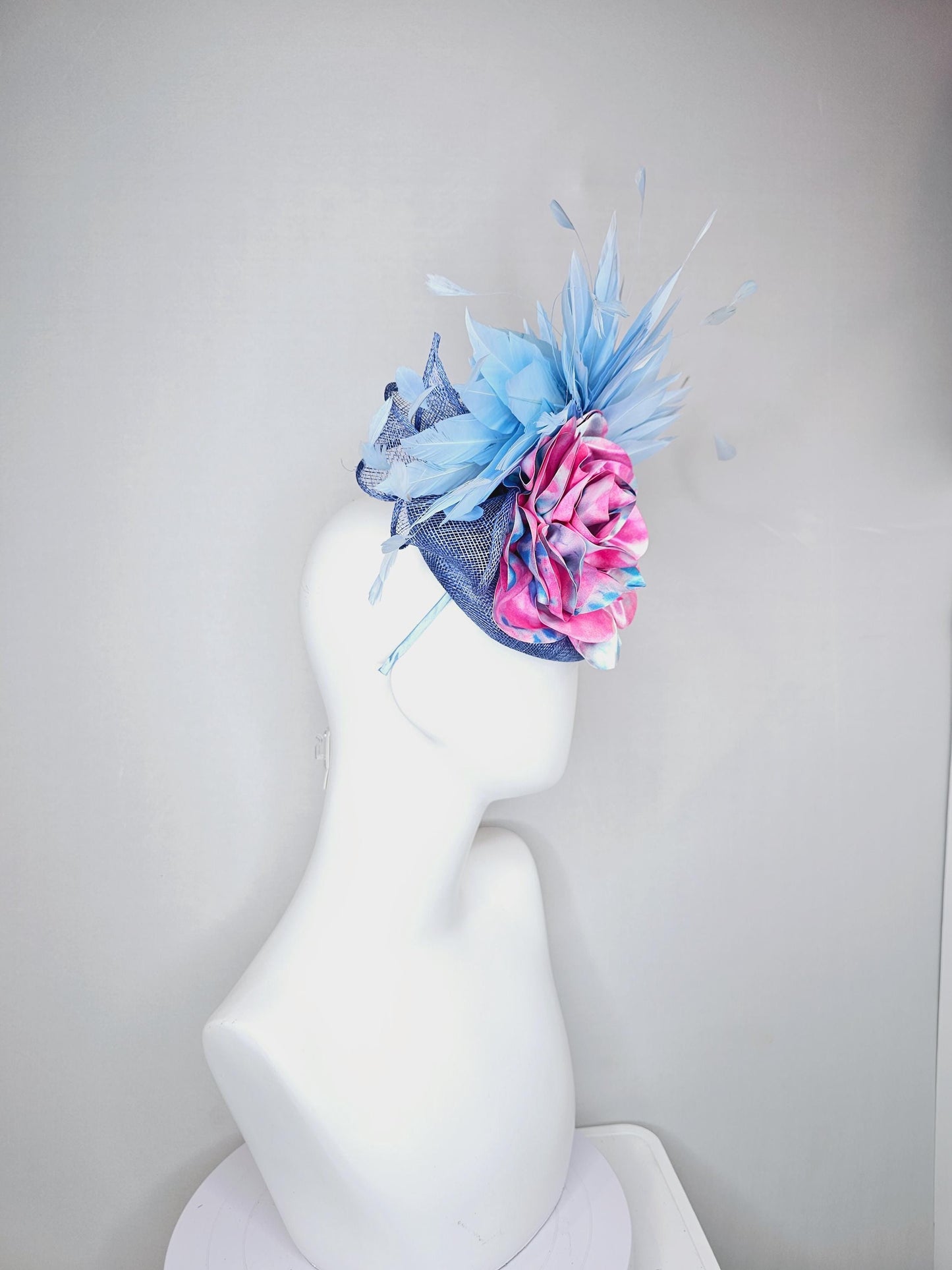 kentucky derby hat fascinator blue sinamay with light blue branching feathers and large pink and blue tie dye satin rose flower