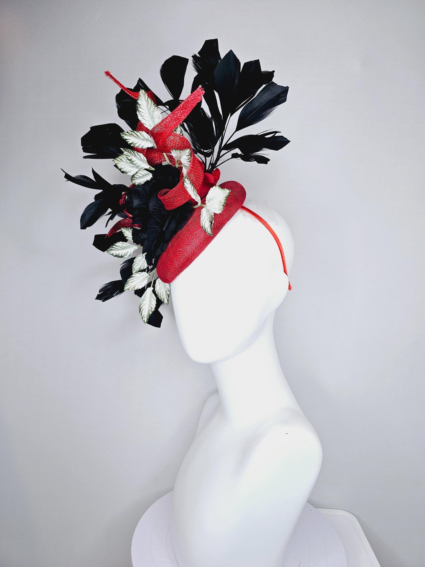 kentucky derby hat fascinator red sinamay base with red sinamay curls, black satin rose flower, ombre green leaves, black branching feathers