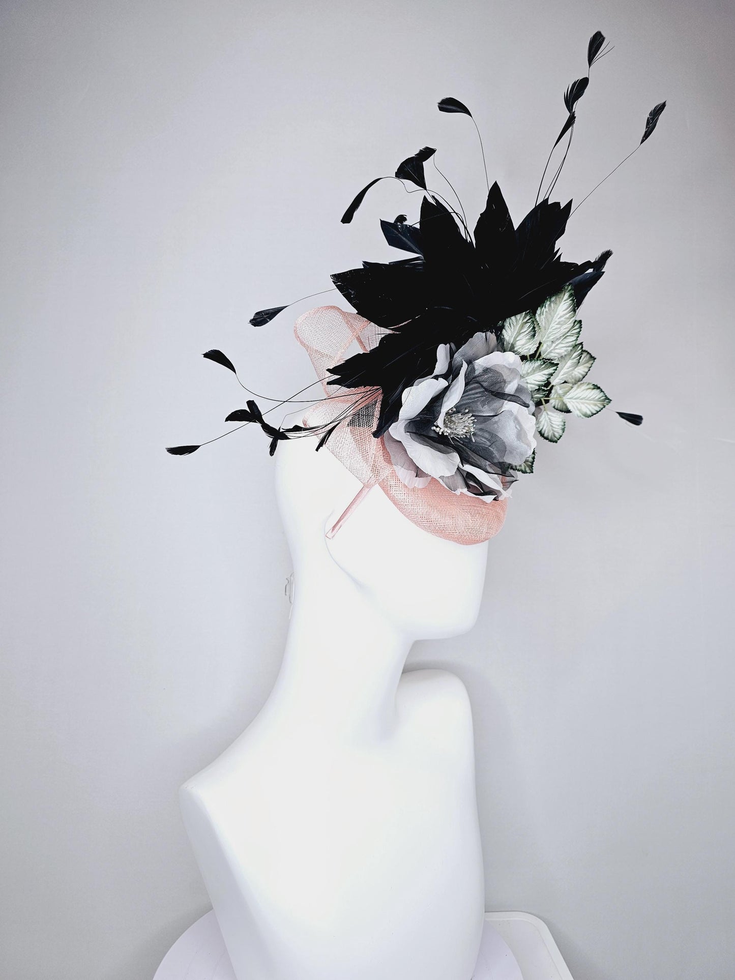 kentucky derby hat fascinator light pink sinamay with black and white organza flower, ombre black green leaves, black branching feathers