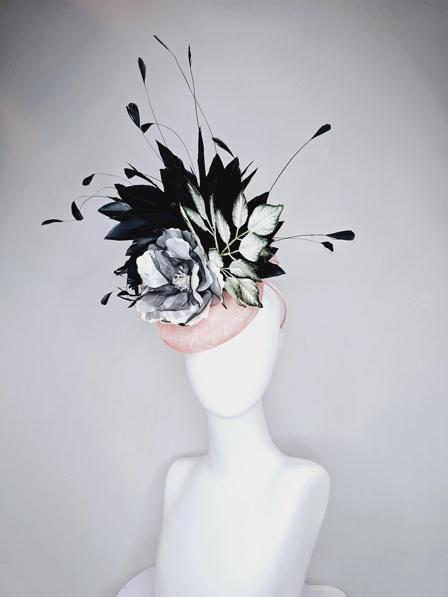 kentucky derby hat fascinator light pink sinamay with black and white organza flower, ombre black green leaves, black branching feathers