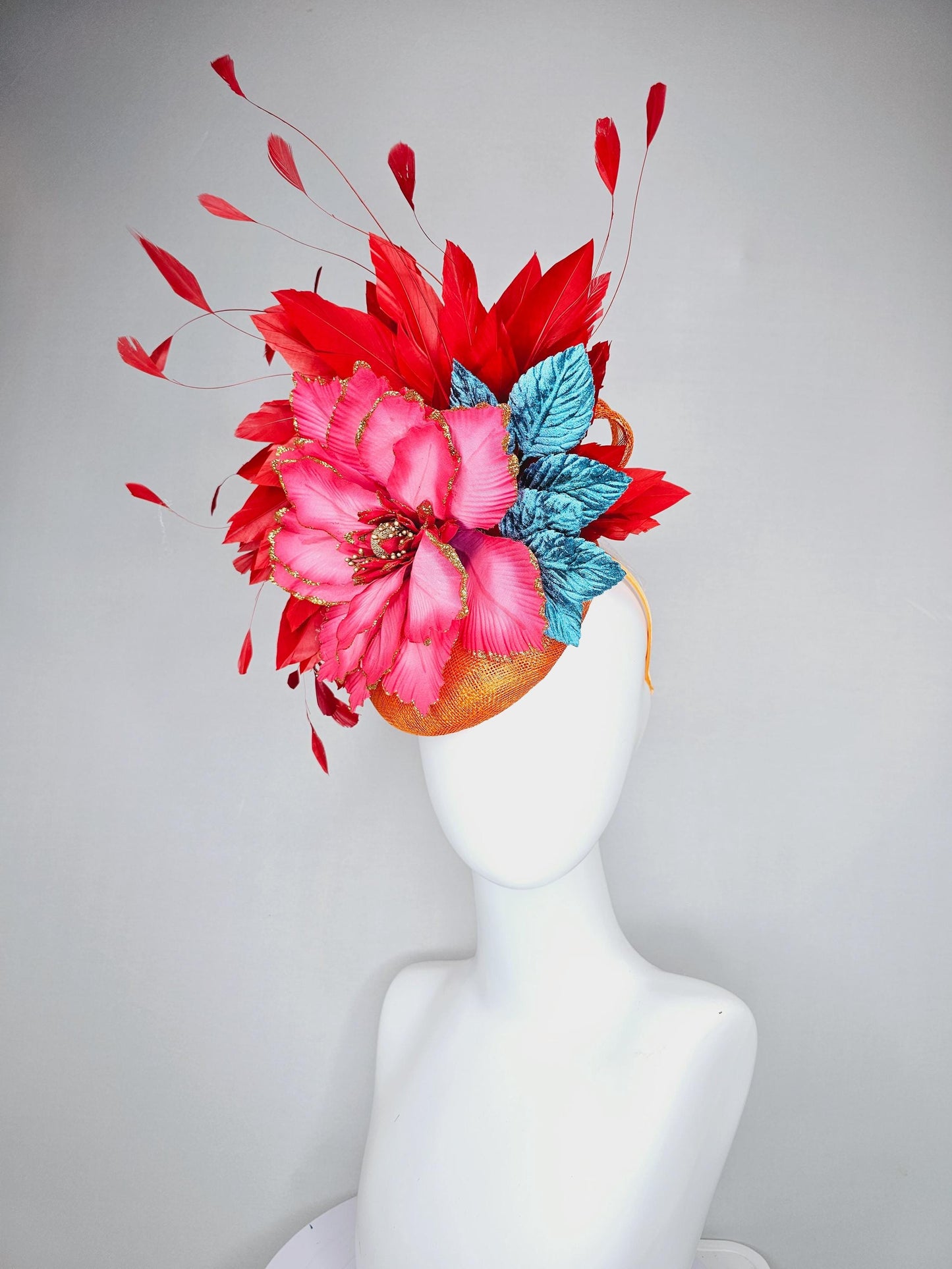 kentucky derby hat fascinator burnt orange sinamay with scarlet red branching feathers, large ombre cherry red satin flower,teal blue leaves