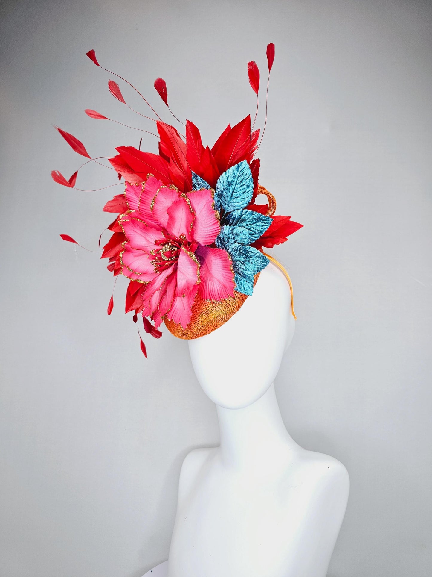 kentucky derby hat fascinator burnt orange sinamay with scarlet red branching feathers, large ombre cherry red satin flower,teal blue leaves