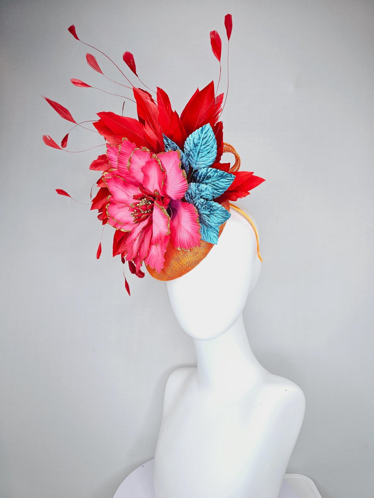 kentucky derby hat fascinator burnt orange sinamay with scarlet red branching feathers, large ombre cherry red satin flower,teal blue leaves