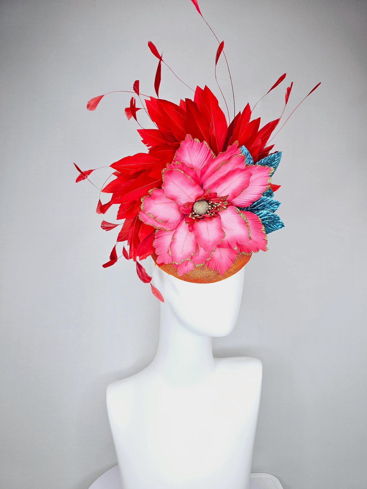 kentucky derby hat fascinator burnt orange sinamay with scarlet red branching feathers, large ombre cherry red satin flower,teal blue leaves