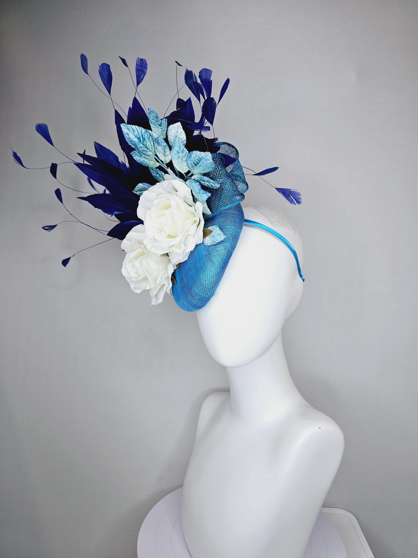 kentucky derby hat fascinator blue sinamay with midnight navy blue branching feathers,light blue ombre leaves,white satin silk rose flowers