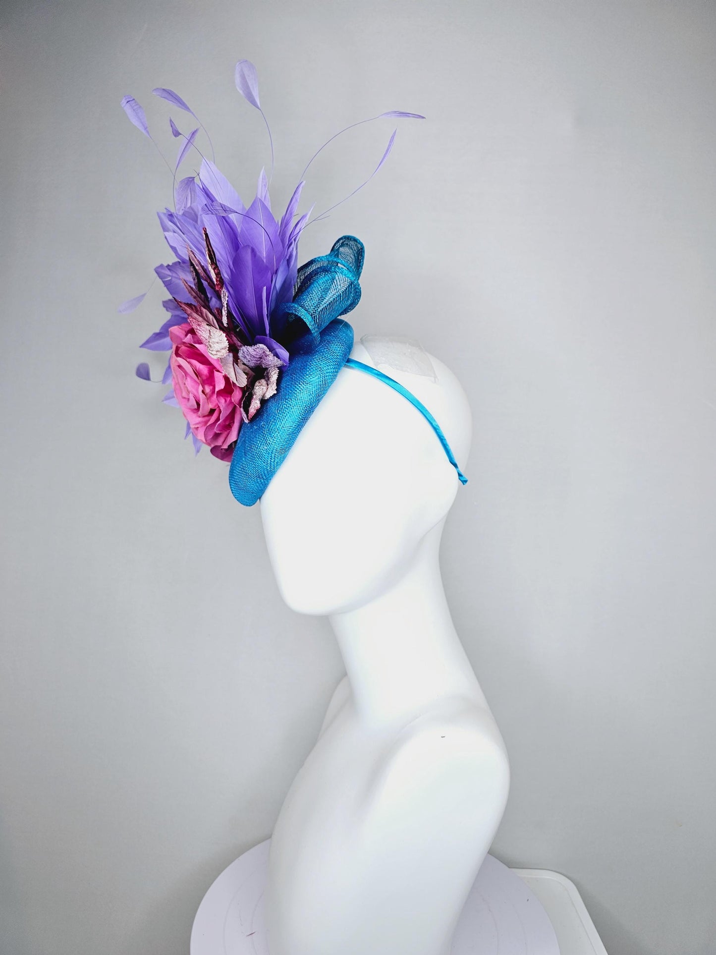 kentucky derby hat fascinator bright blue sinamay,lavender purple branching feathers,pink satin silk rose,pink beige ombre velvet leaves