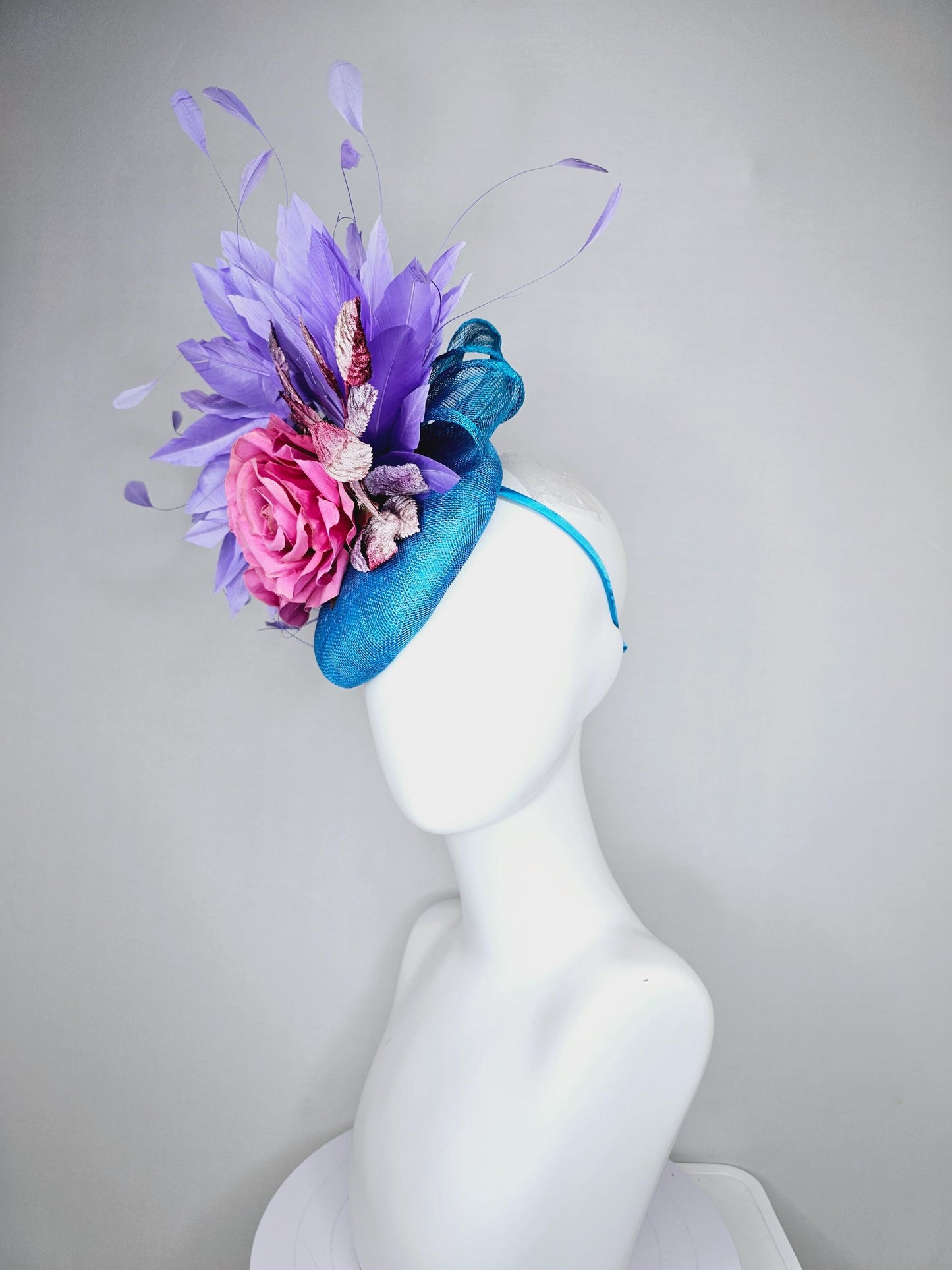 kentucky derby hat fascinator bright blue sinamay,lavender purple branching feathers,pink satin silk rose,pink beige ombre velvet leaves