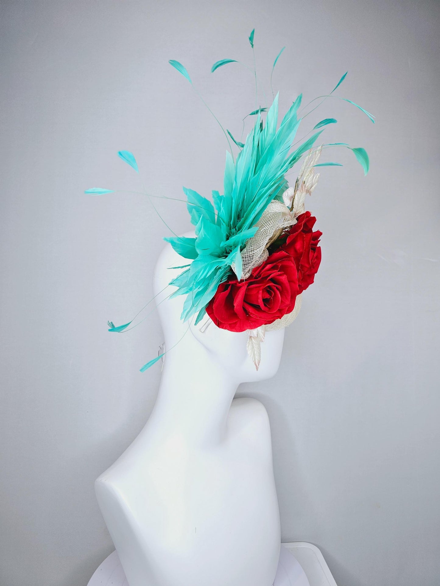 kentucky derby hat fascinator white ivory sinamay with white velvet leaves,aqua green blue branching feathers,bright red satin silk roses