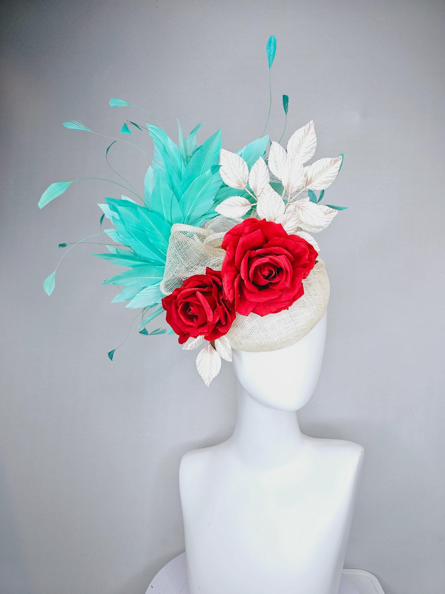 kentucky derby hat fascinator white ivory sinamay with white velvet leaves,aqua green blue branching feathers,bright red satin silk roses