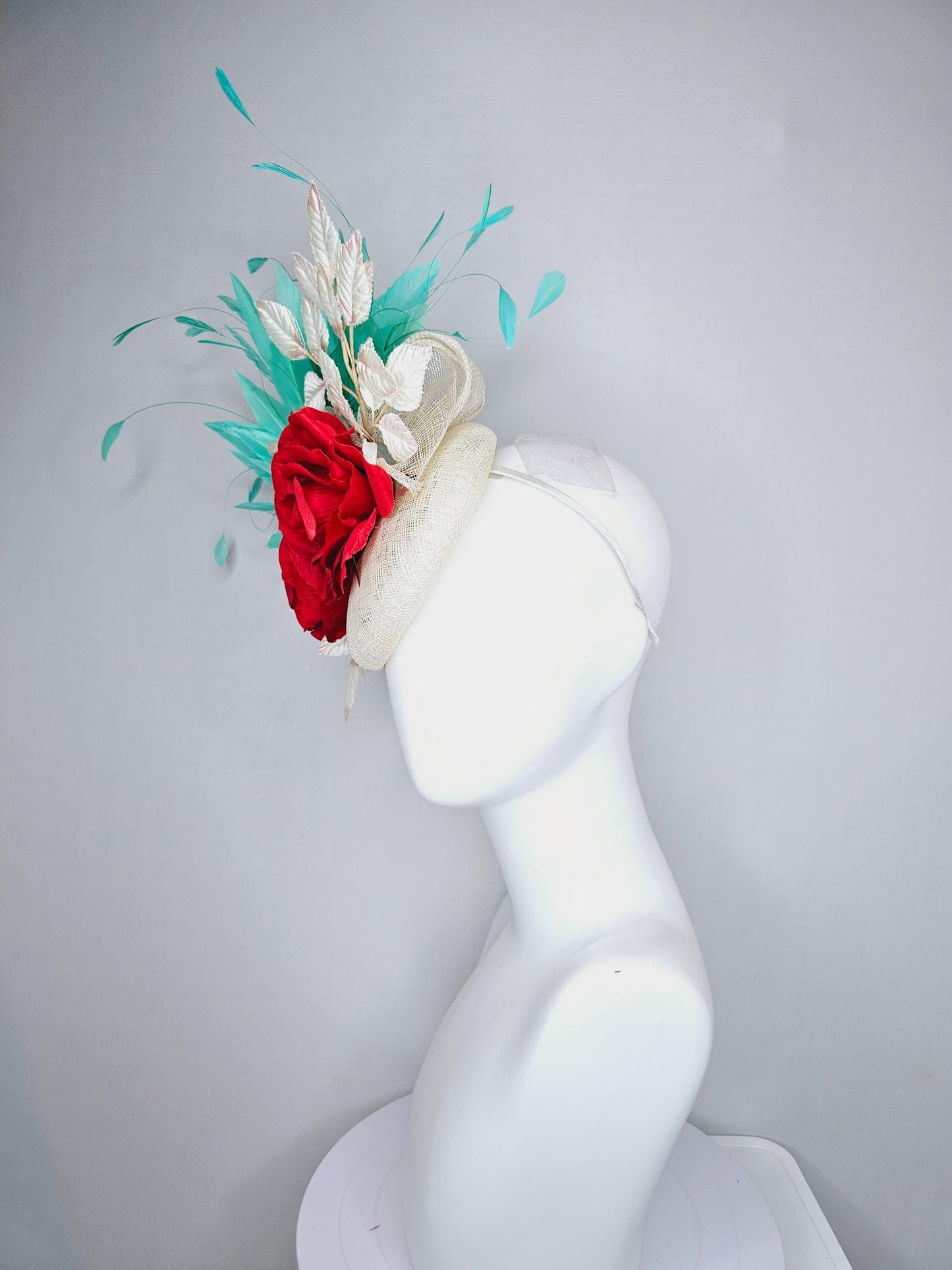 kentucky derby hat fascinator white ivory sinamay with white velvet leaves,aqua green blue branching feathers,bright red satin silk roses