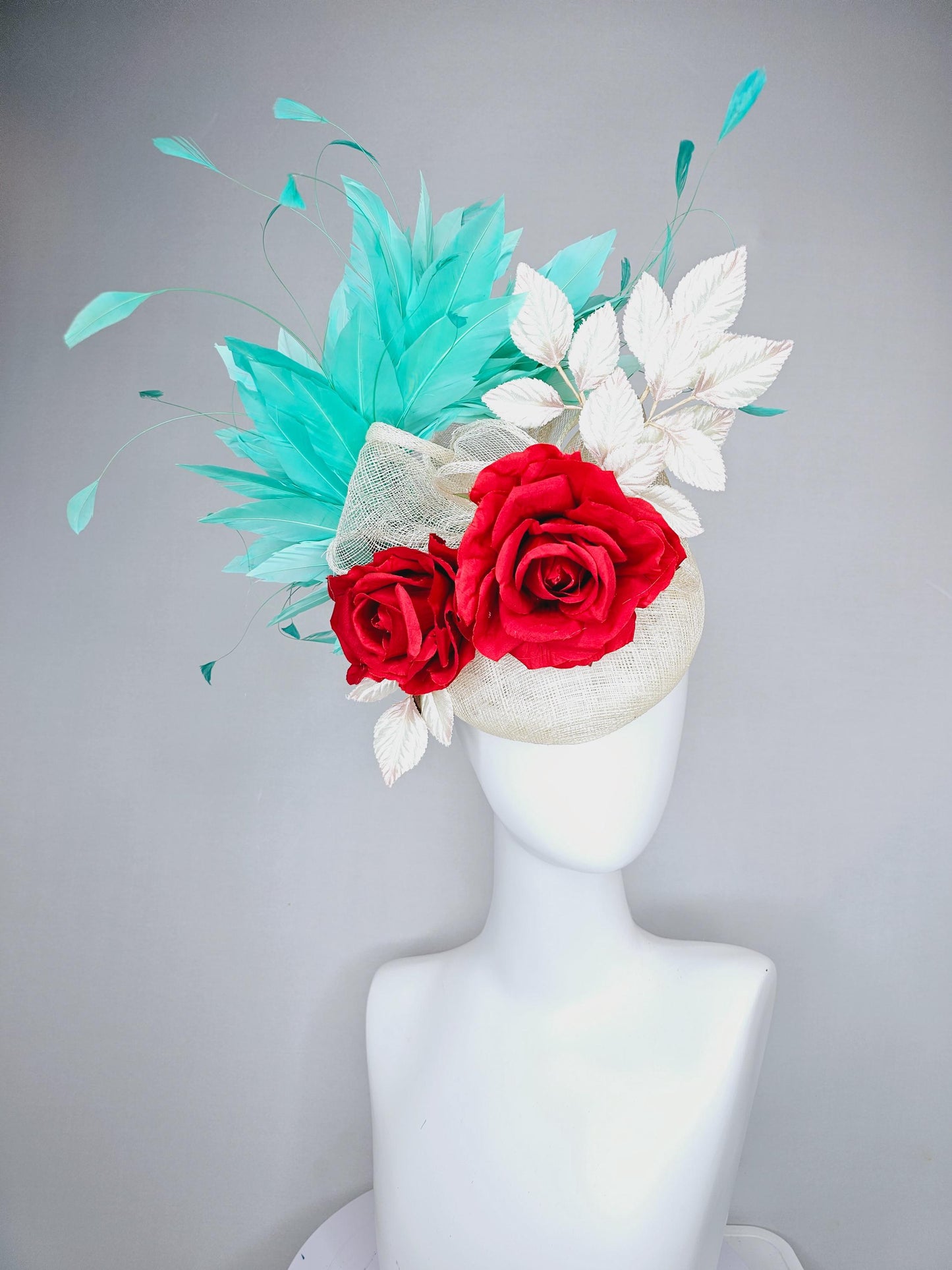 kentucky derby hat fascinator white ivory sinamay with white velvet leaves,aqua green blue branching feathers,bright red satin silk roses