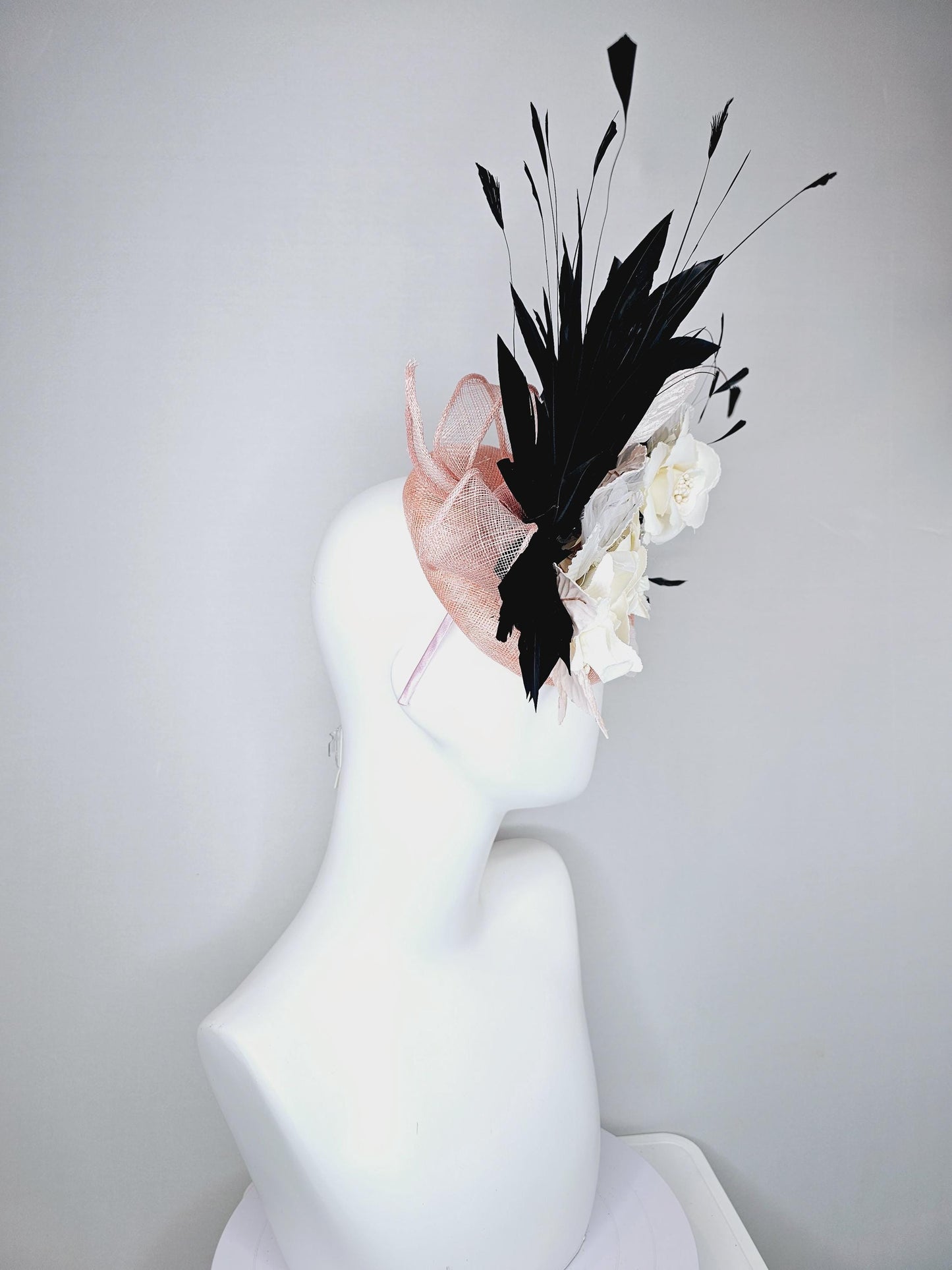 kentucky derby hat fascinator light pink sinamay with ivory white satin silk flowers, light pink white leaves, black branching feathers