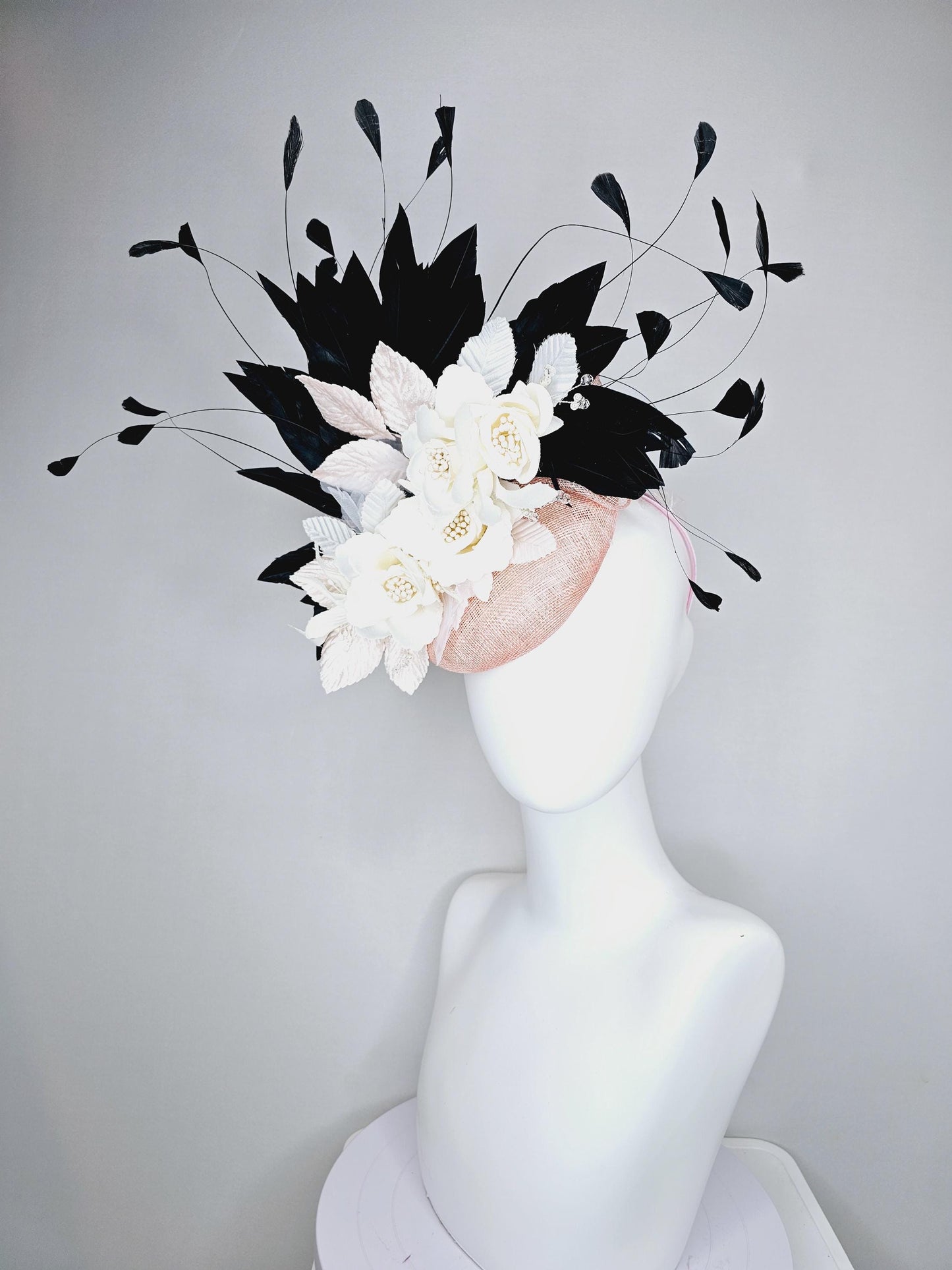 kentucky derby hat fascinator light pink sinamay with ivory white satin silk flowers, light pink white leaves, black branching feathers