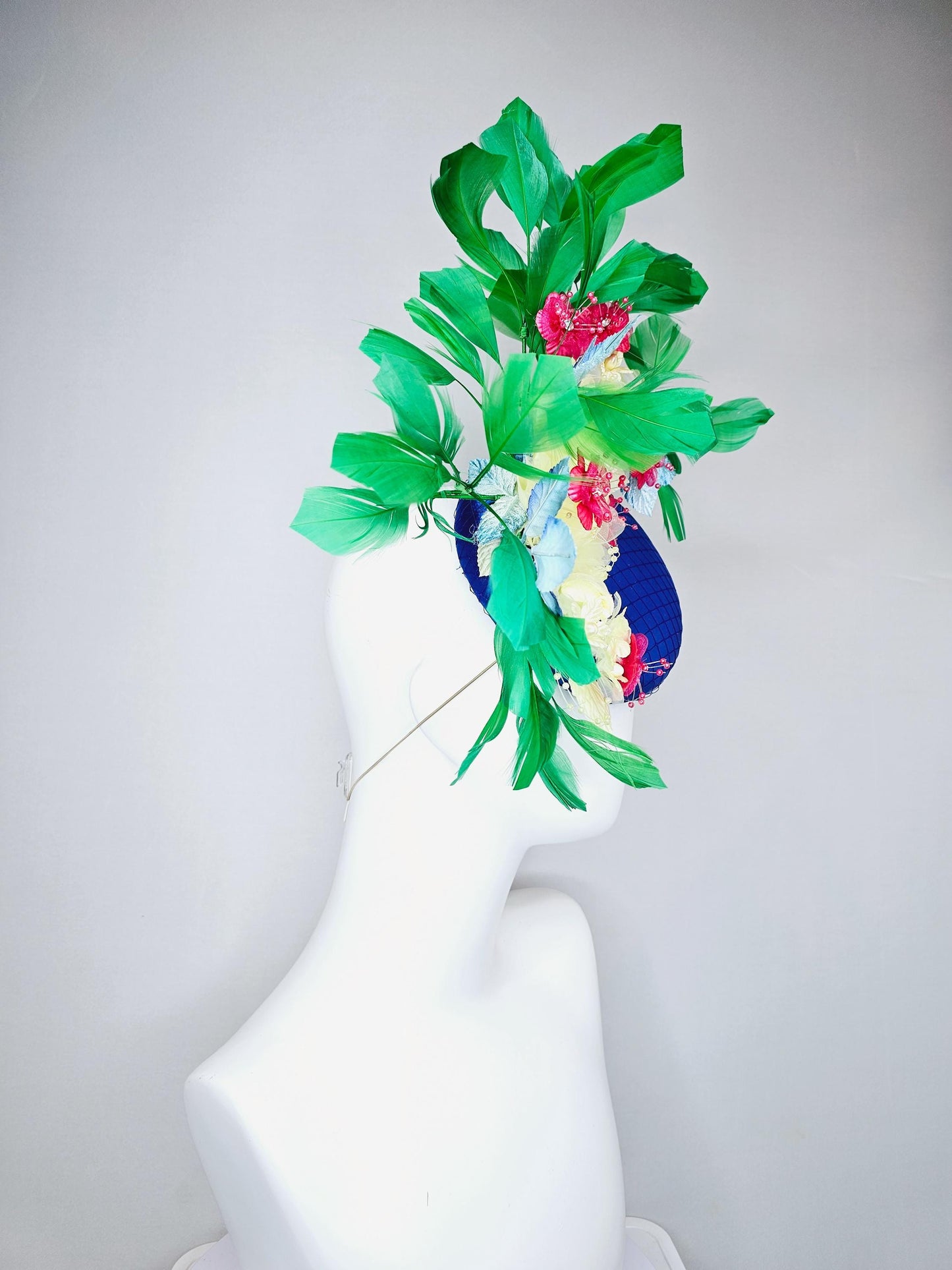 kentucky derby hat fascinator royal blue satin w/ netting, light yellow pink organza satin flowers, ombre blue leaves,emerald green feathers