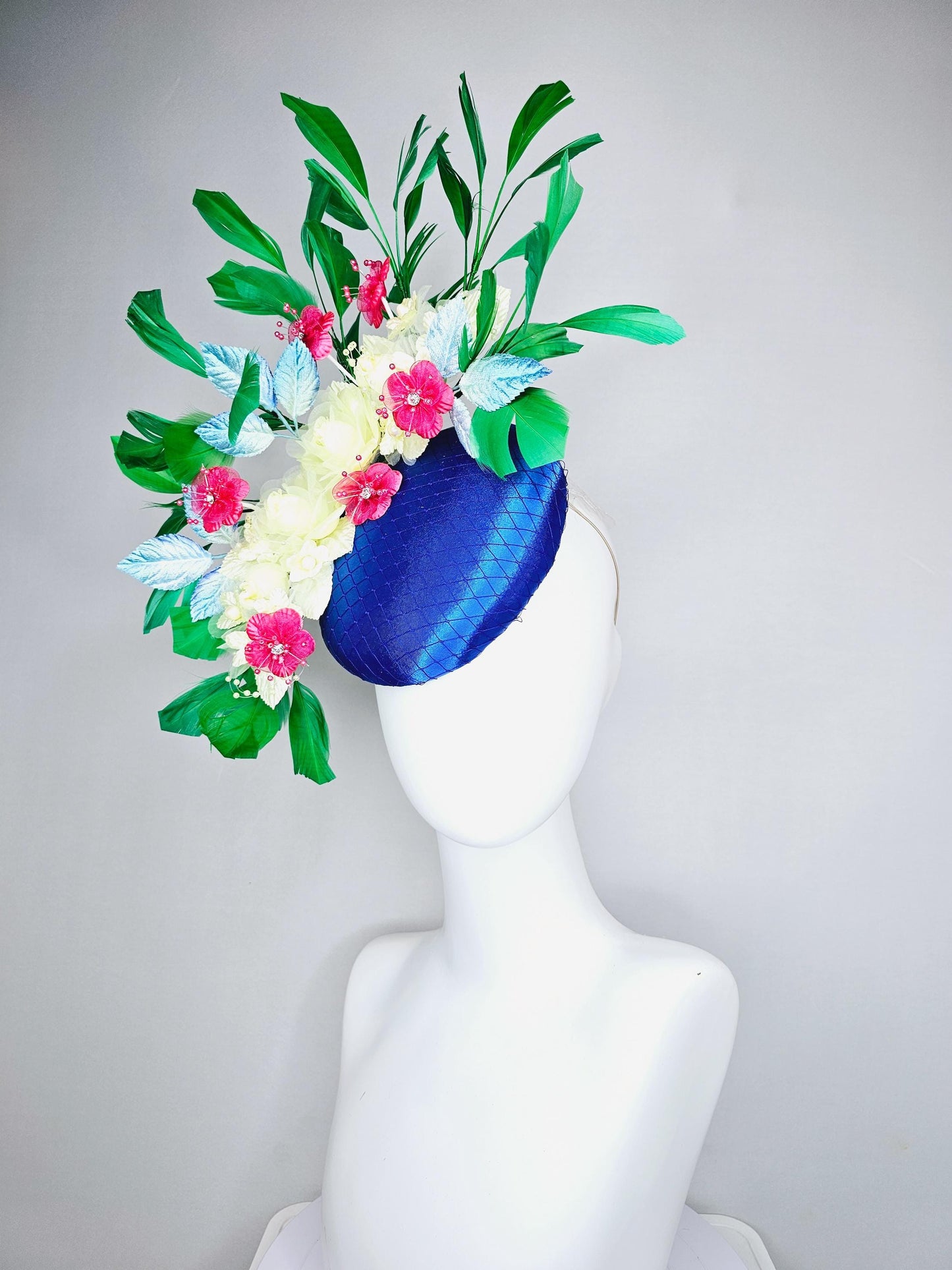 kentucky derby hat fascinator royal blue satin w/ netting, light yellow pink organza satin flowers, ombre blue leaves,emerald green feathers