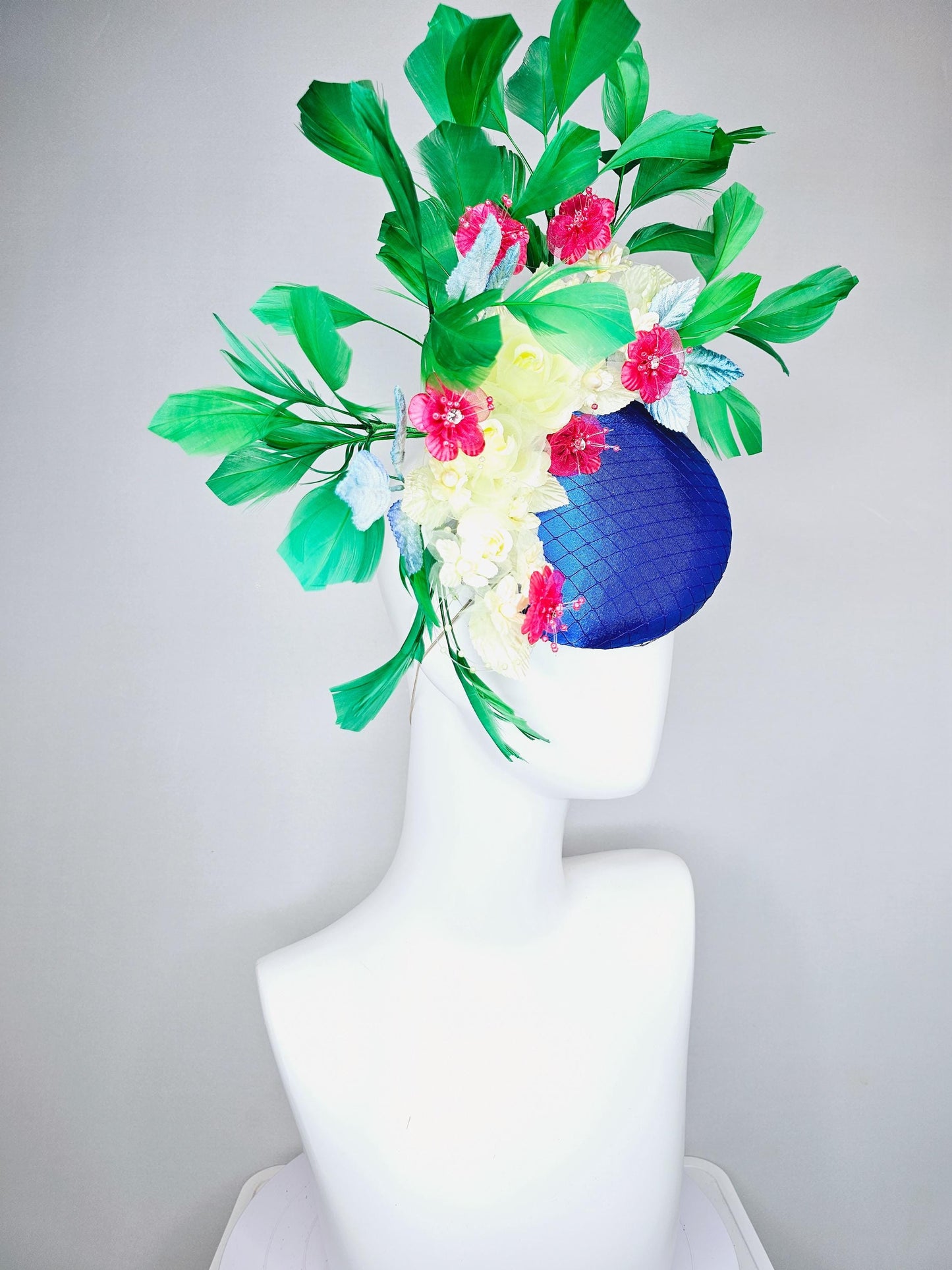 kentucky derby hat fascinator royal blue satin w/ netting, light yellow pink organza satin flowers, ombre blue leaves,emerald green feathers