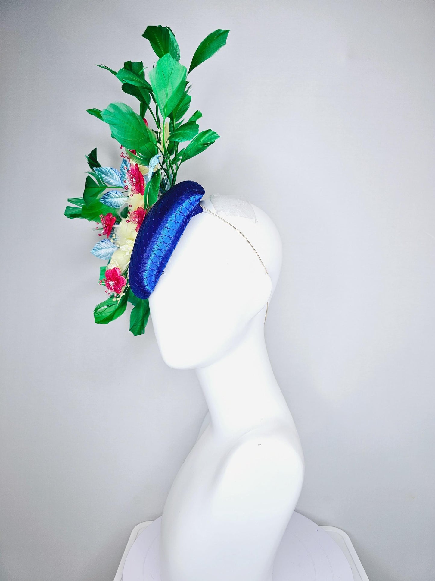 kentucky derby hat fascinator royal blue satin w/ netting, light yellow pink organza satin flowers, ombre blue leaves,emerald green feathers