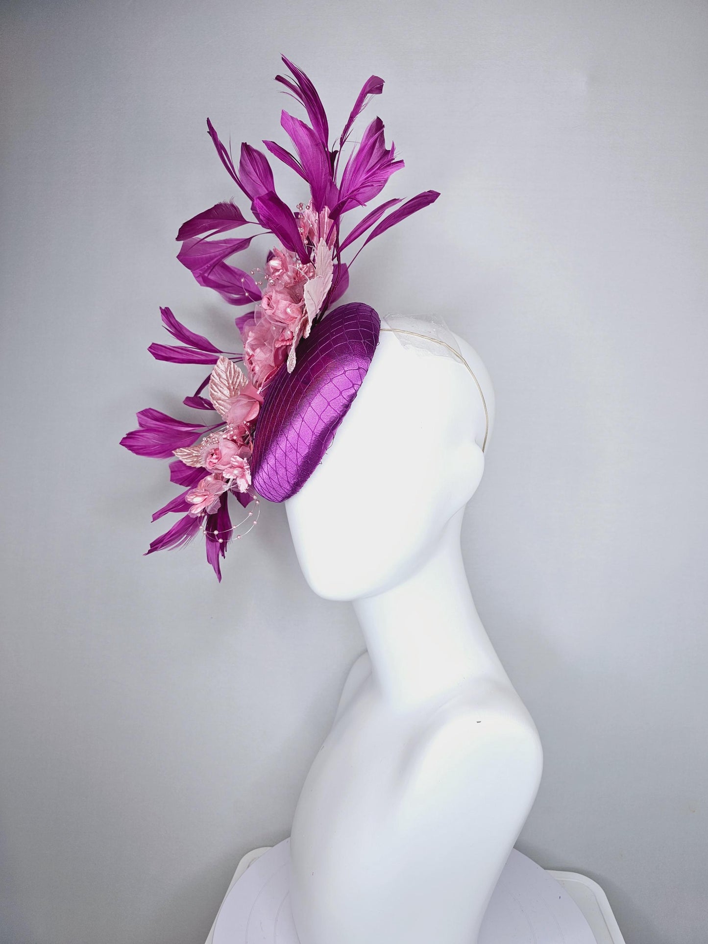 kentucky derby hat fascinator purple satin with netting, light blush pink organza satin flowers, light pink leaves, magenta purple feathers