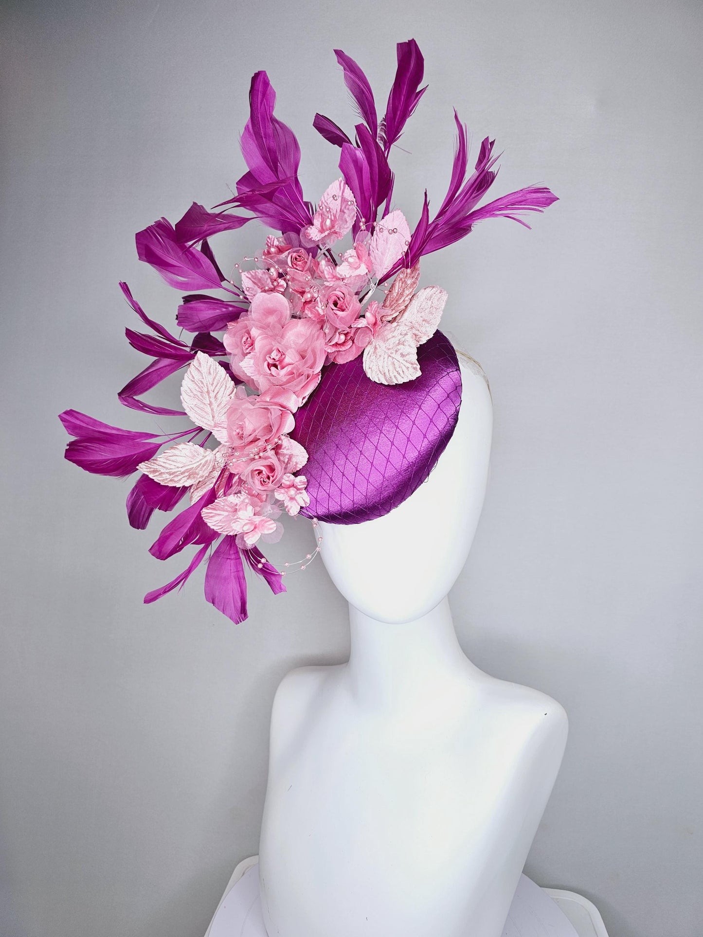 kentucky derby hat fascinator purple satin with netting, light blush pink organza satin flowers, light pink leaves, magenta purple feathers