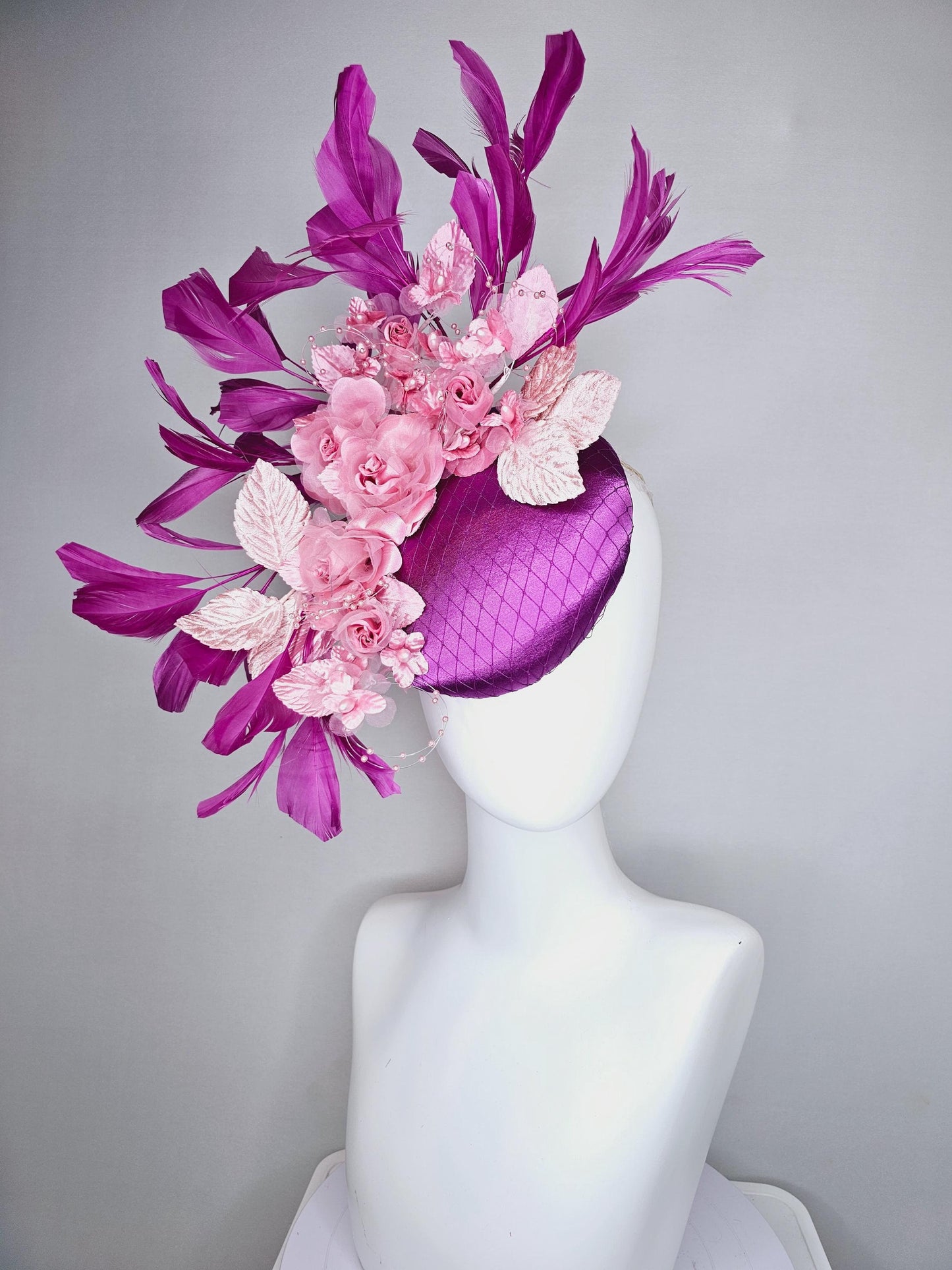 kentucky derby hat fascinator purple satin with netting, light blush pink organza satin flowers, light pink leaves, magenta purple feathers