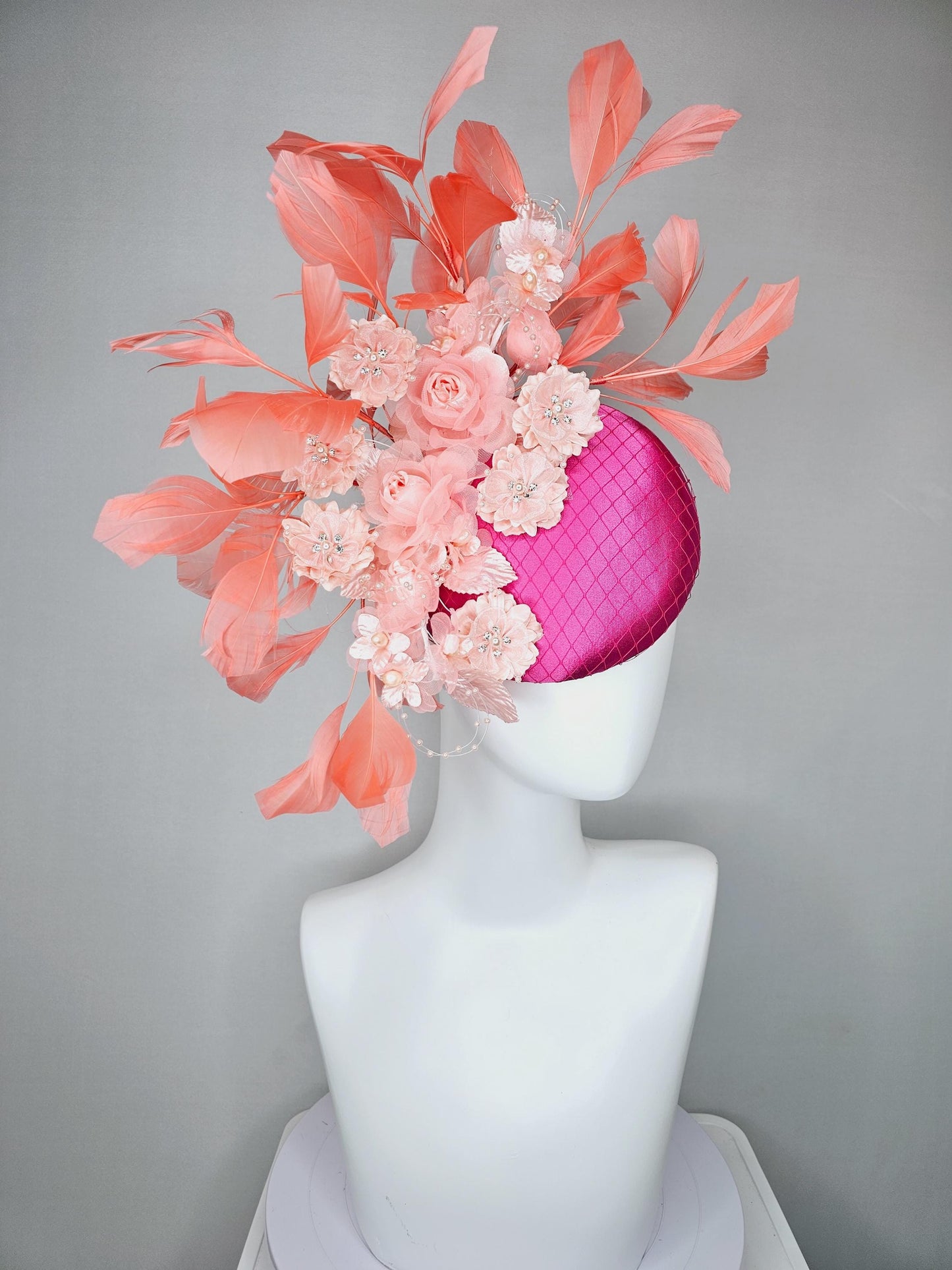 kentucky derby hat fascinator bright pink satin with netting, light blush pink organza satin flowers,light pink leaves,coral orange feathers