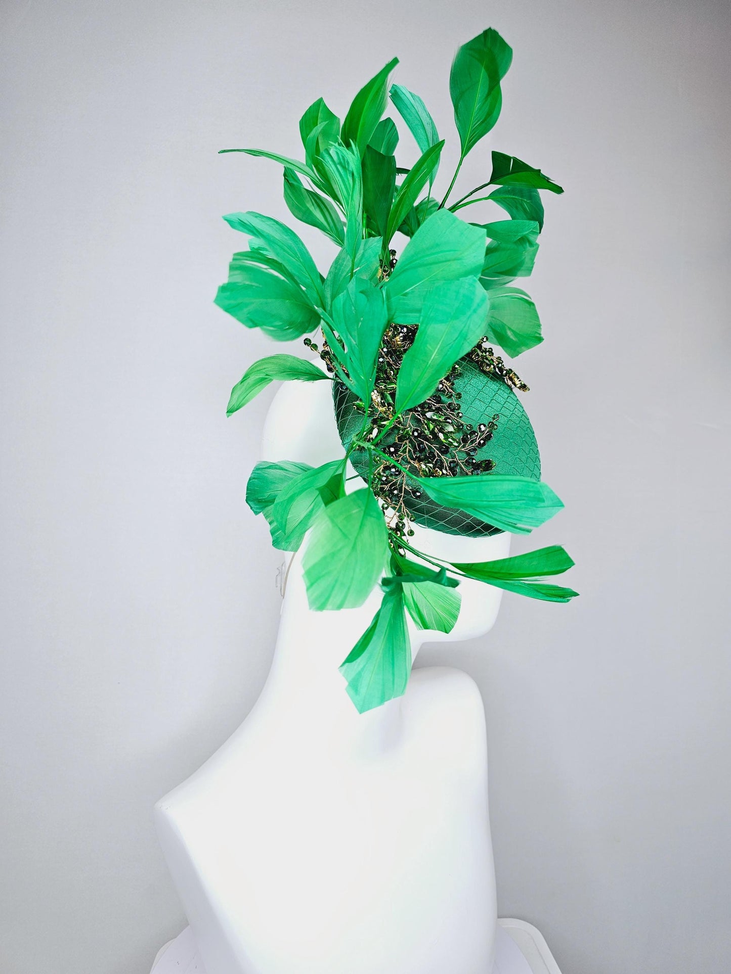 kentucky derby hat fascinator emerald green satin with netting and green crystal beaded jewels stems, emerald green branching feathers