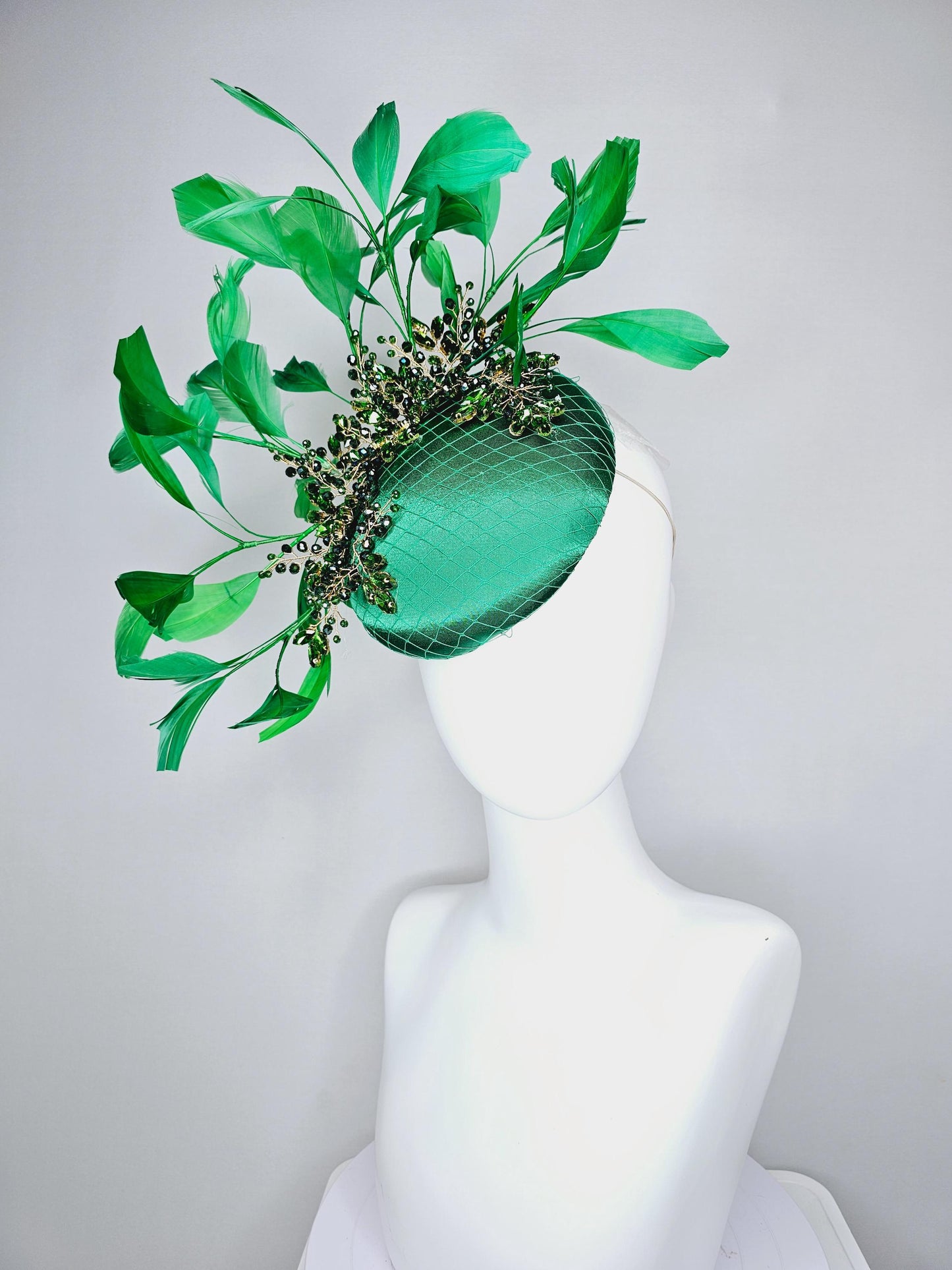 kentucky derby hat fascinator emerald green satin with netting and green crystal beaded jewels stems, emerald green branching feathers