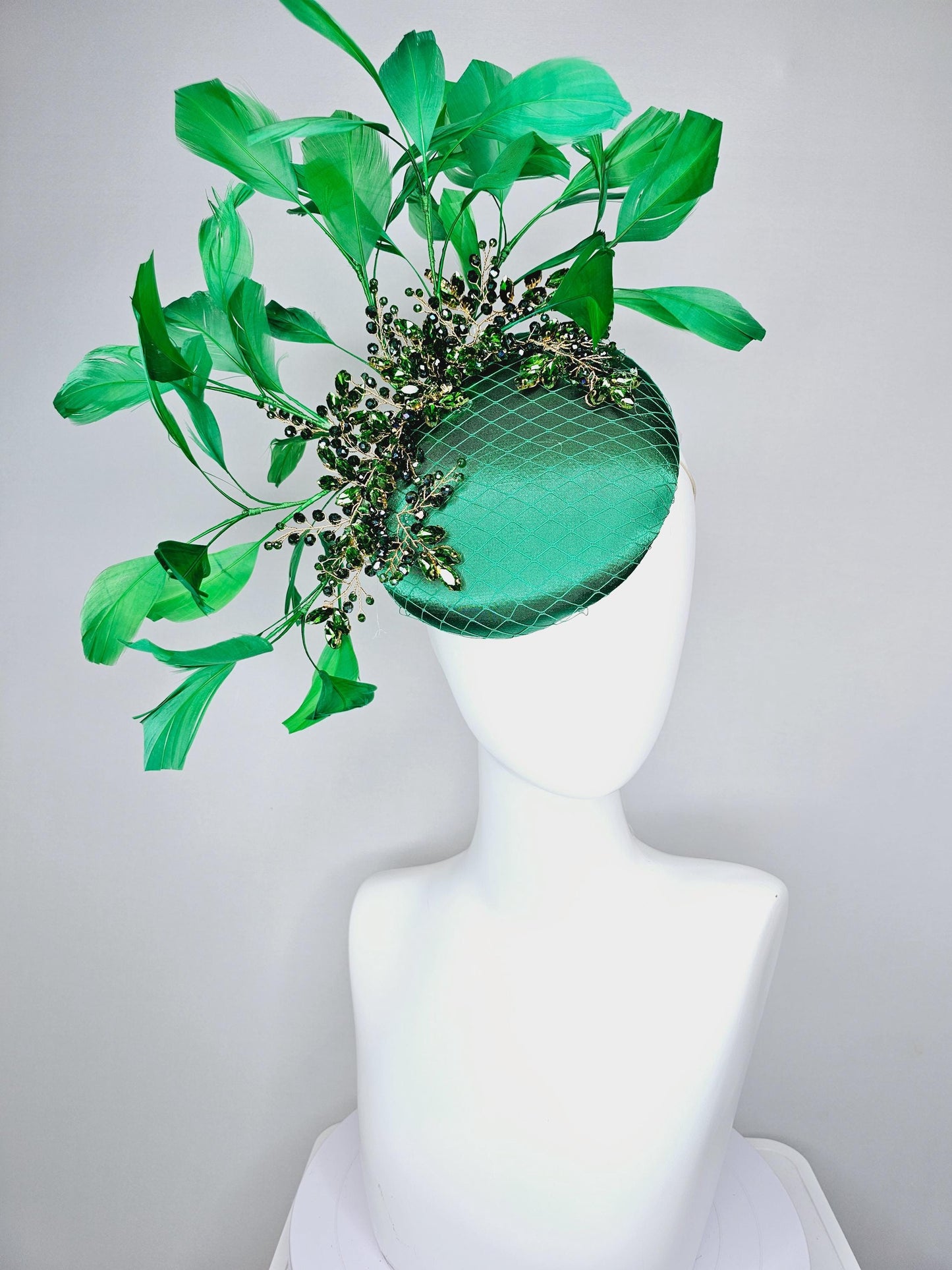 kentucky derby hat fascinator emerald green satin with netting and green crystal beaded jewels stems, emerald green branching feathers