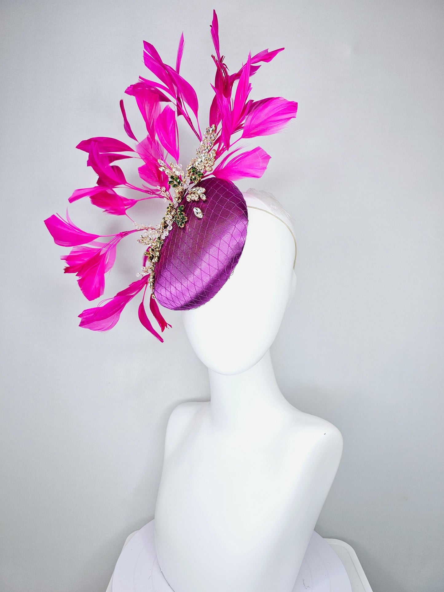 kentucky derby hat fascinator purple satin with netting,green and clear crystal beaded jewels stems,bright pink fuchsia branching feathers