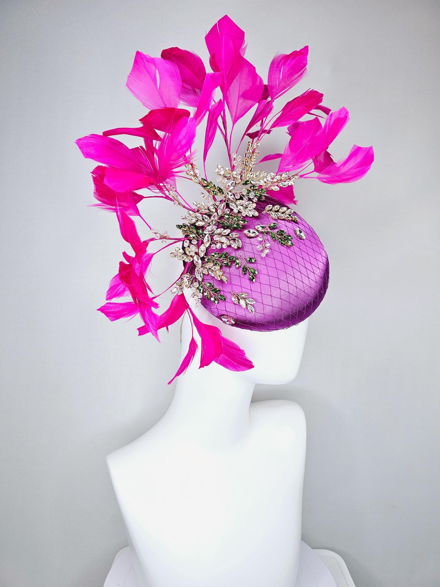 kentucky derby hat fascinator purple satin with netting,green and clear crystal beaded jewels stems,bright pink fuchsia branching feathers