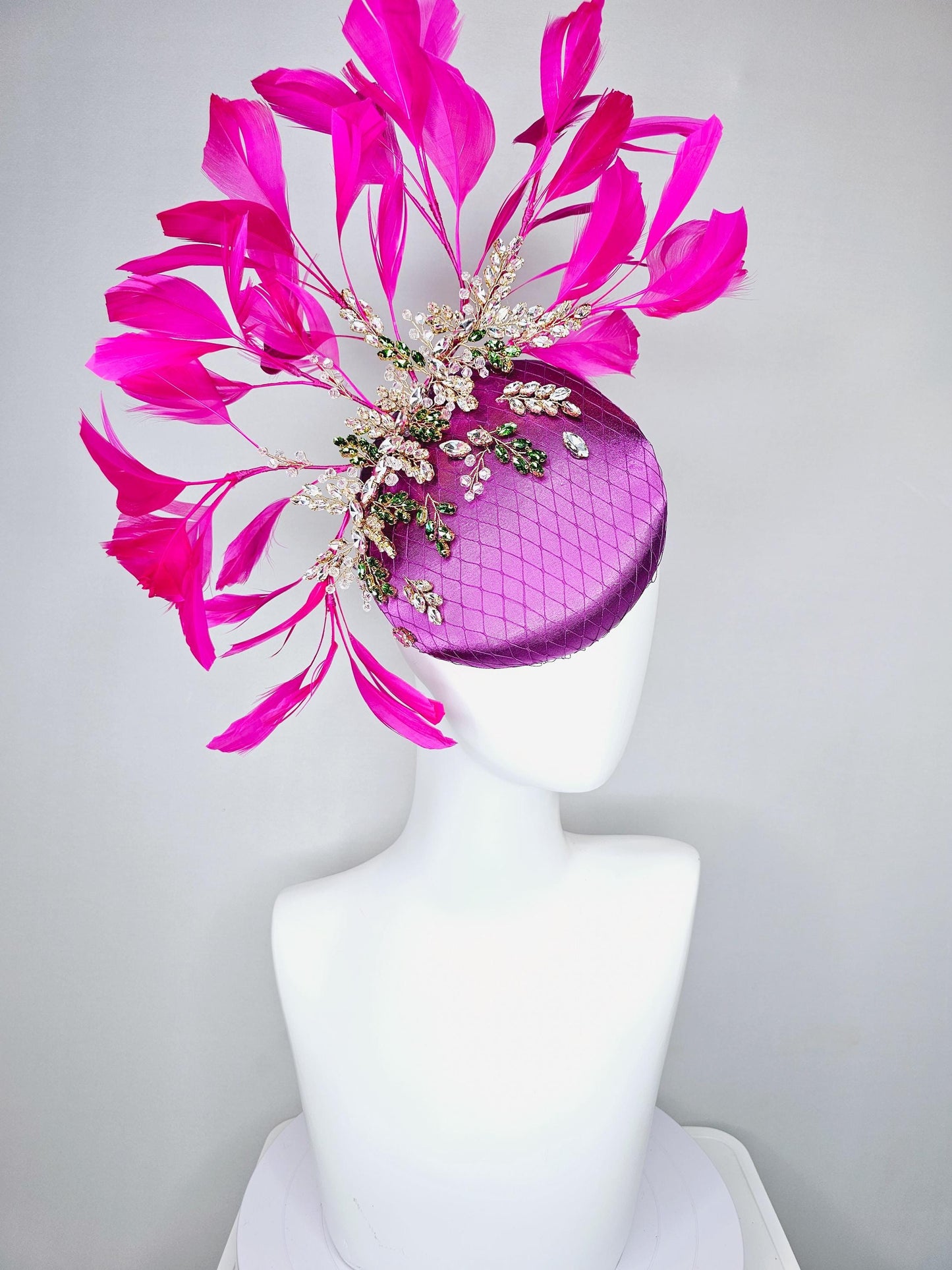 kentucky derby hat fascinator purple satin with netting,green and clear crystal beaded jewels stems,bright pink fuchsia branching feathers