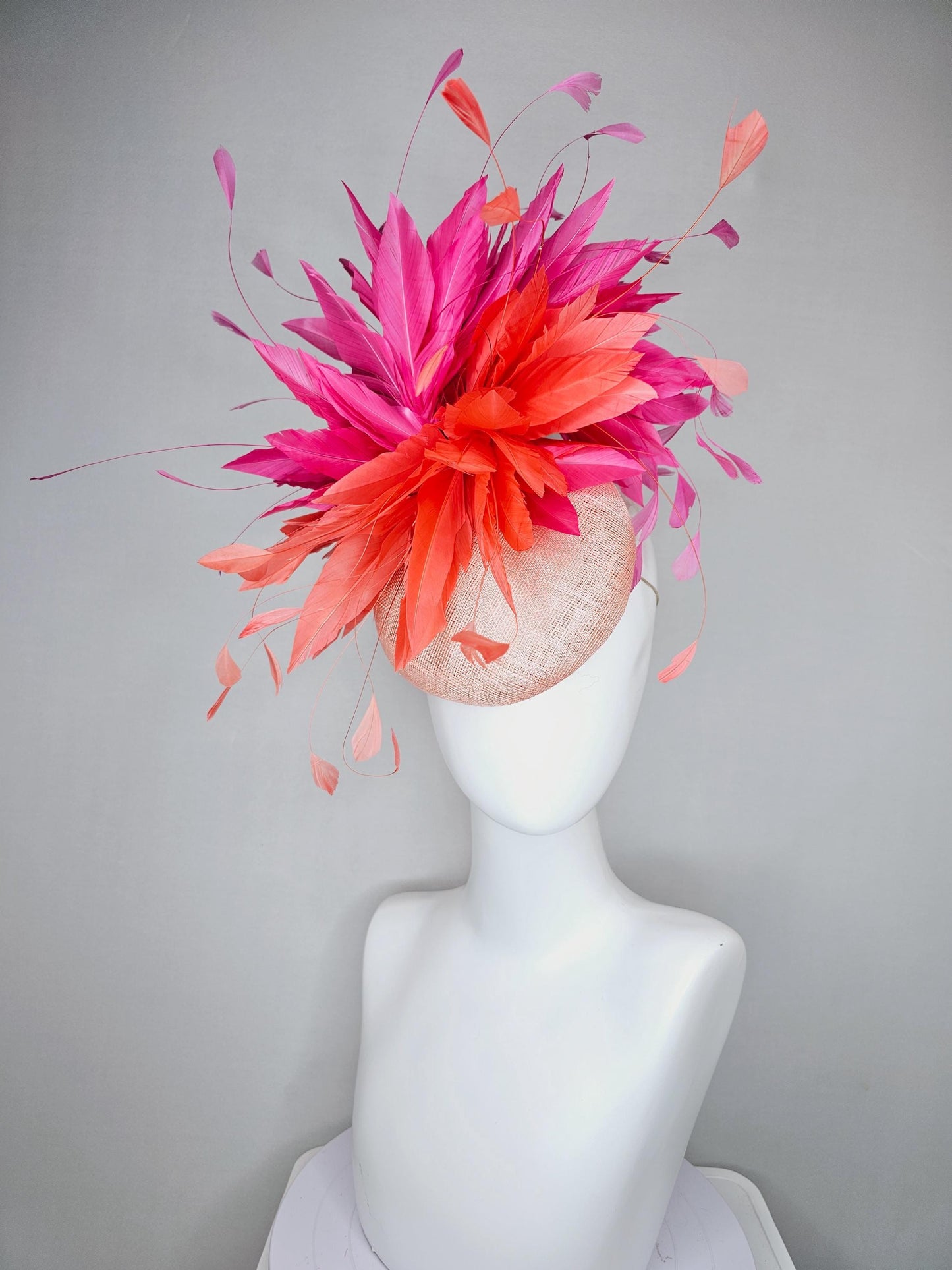 kentucky derby hat fascinator light orange peach sinamay with fluffy coral orange and hot pink branching feathers