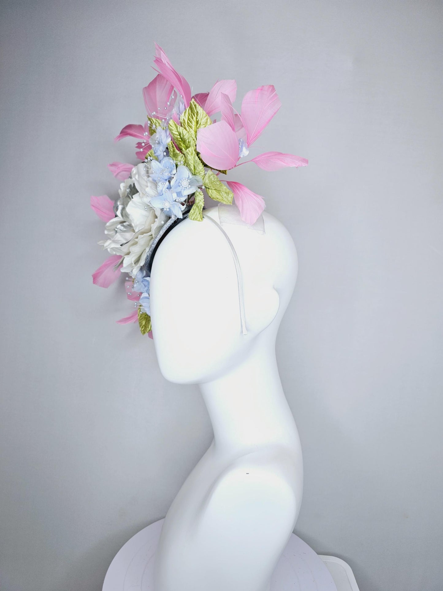 kentucky derby hat fascinator large white silver satin flower, small lavender blue organza satin flowers, green leaves, light pink feathers