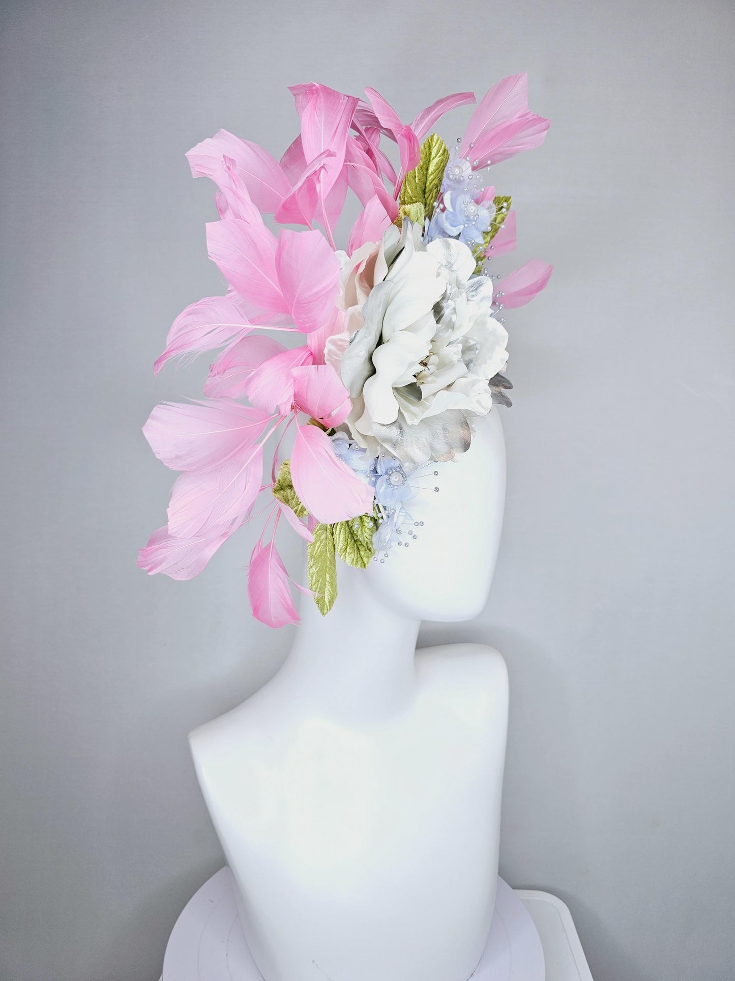 kentucky derby hat fascinator large white silver satin flower, small lavender blue organza satin flowers, green leaves, light pink feathers