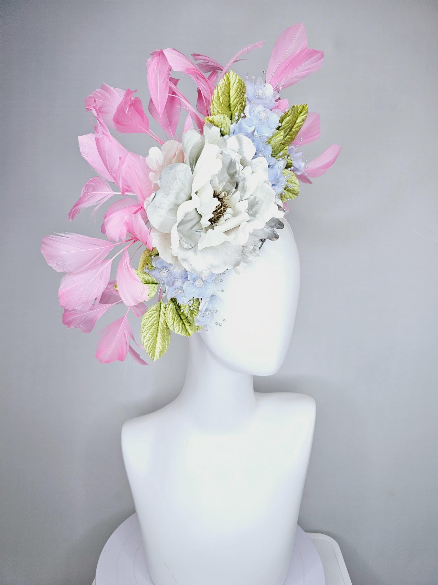 kentucky derby hat fascinator large white silver satin flower, small lavender blue organza satin flowers, green leaves, light pink feathers