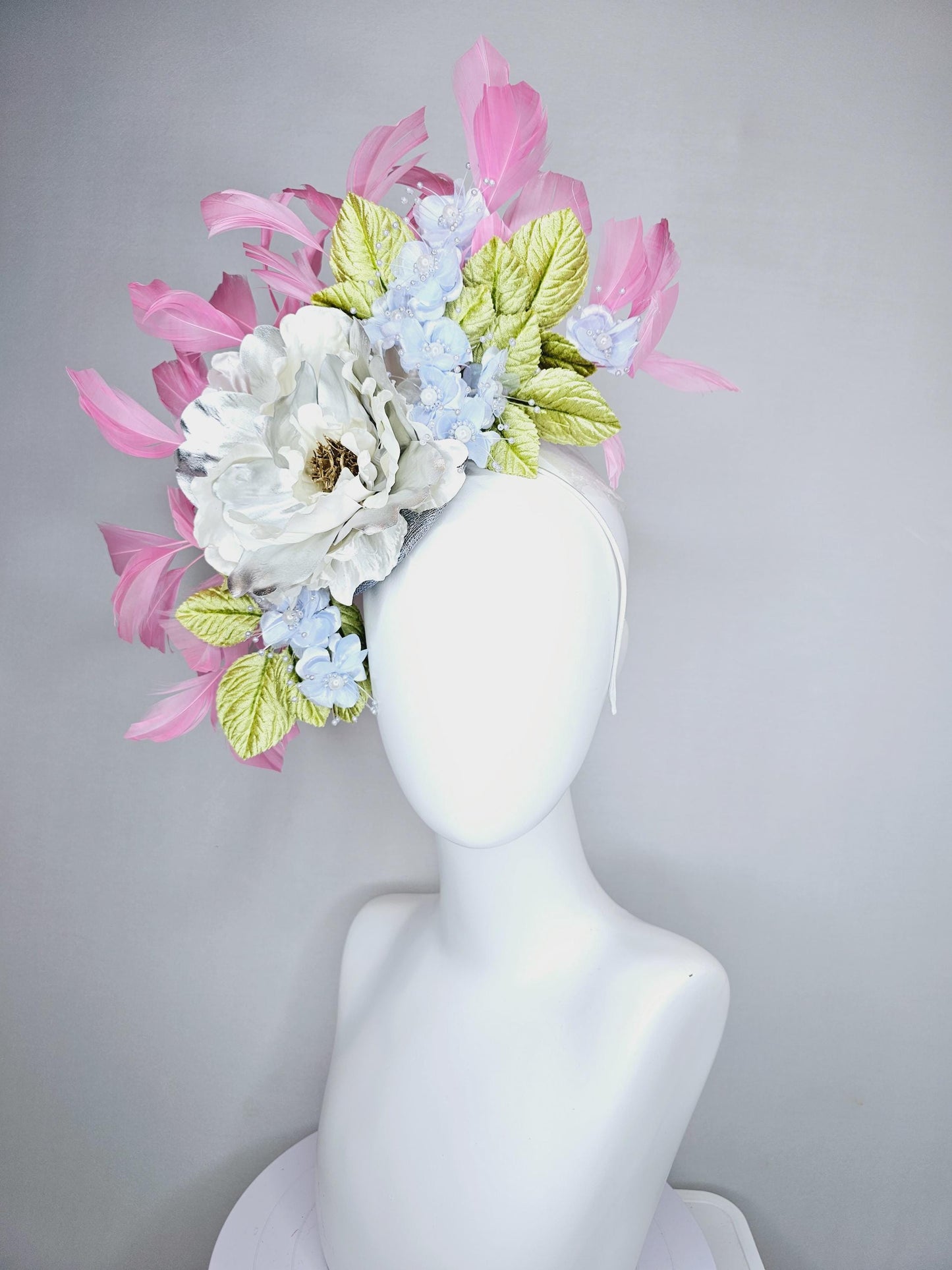 kentucky derby hat fascinator large white silver satin flower, small lavender blue organza satin flowers, green leaves, light pink feathers