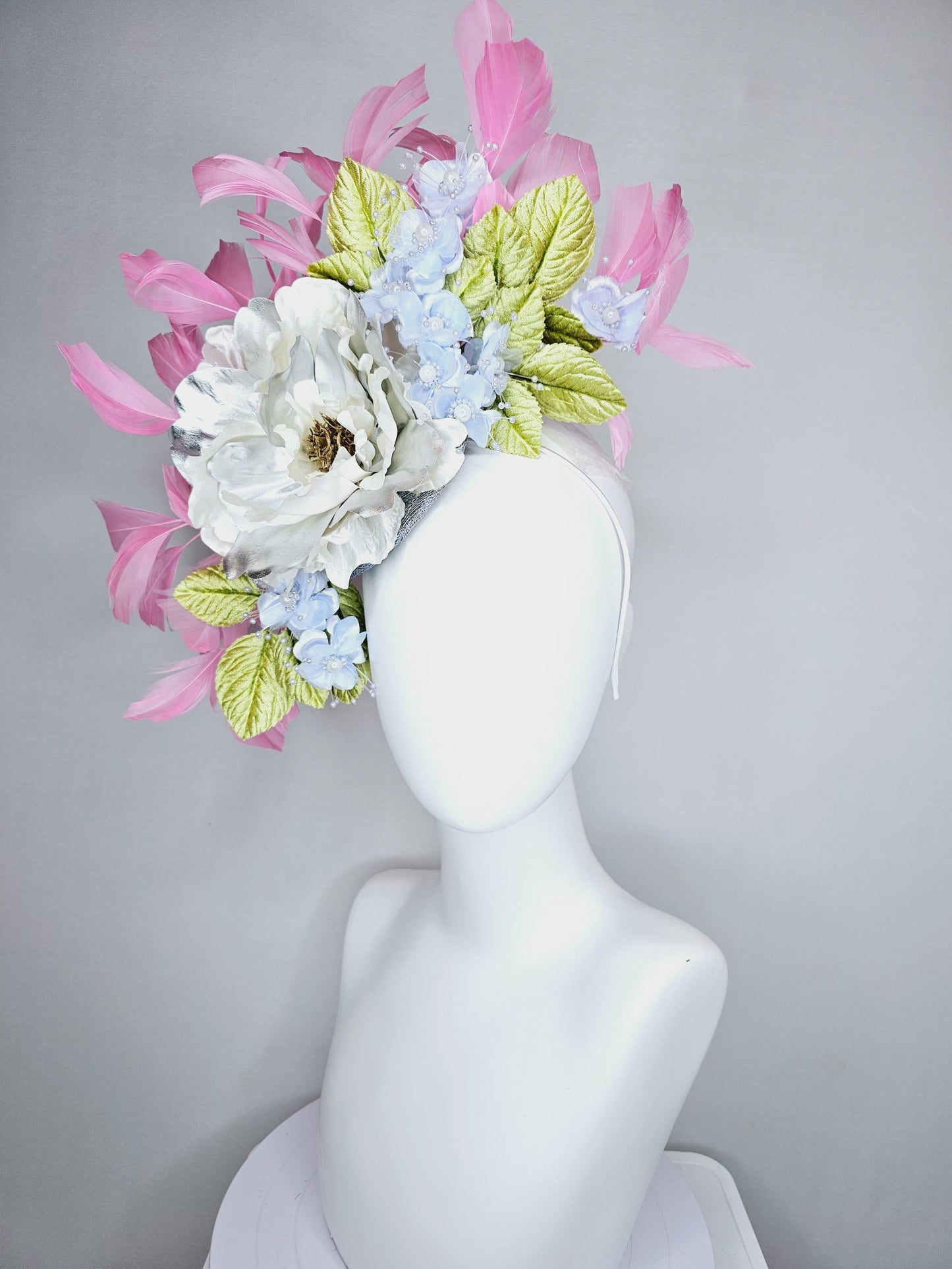 kentucky derby hat fascinator large white silver satin flower, small lavender blue organza satin flowers, green leaves, light pink feathers