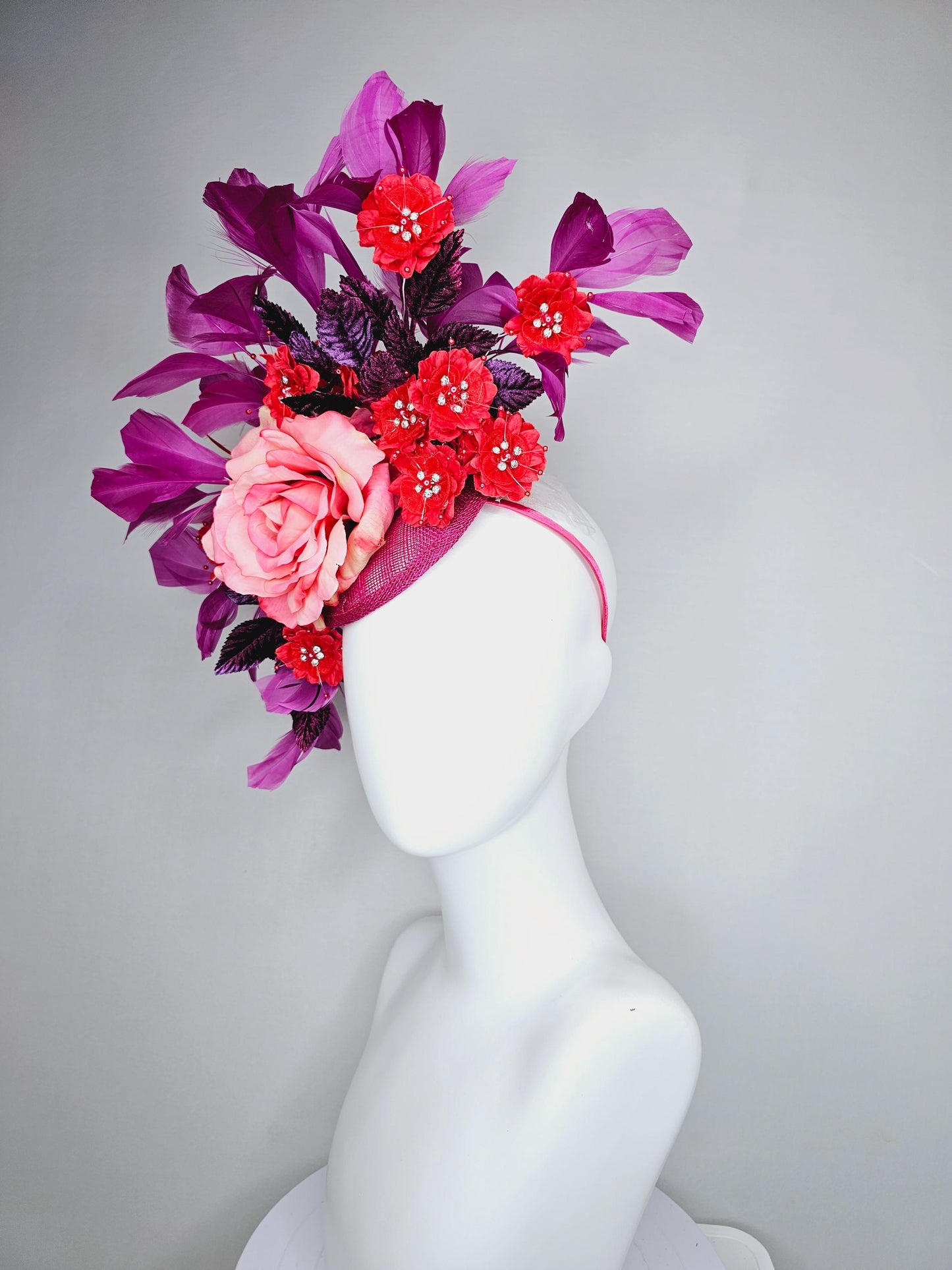 kentucky derby hat fascinator pink ombre satin rose, scarlet red satin flowers, purple leaves, magenta purple branching feathers